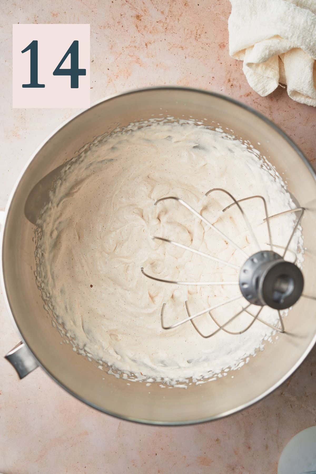 whipped cream in a mixing bowl with a whisk attachment from a stand mixer. 