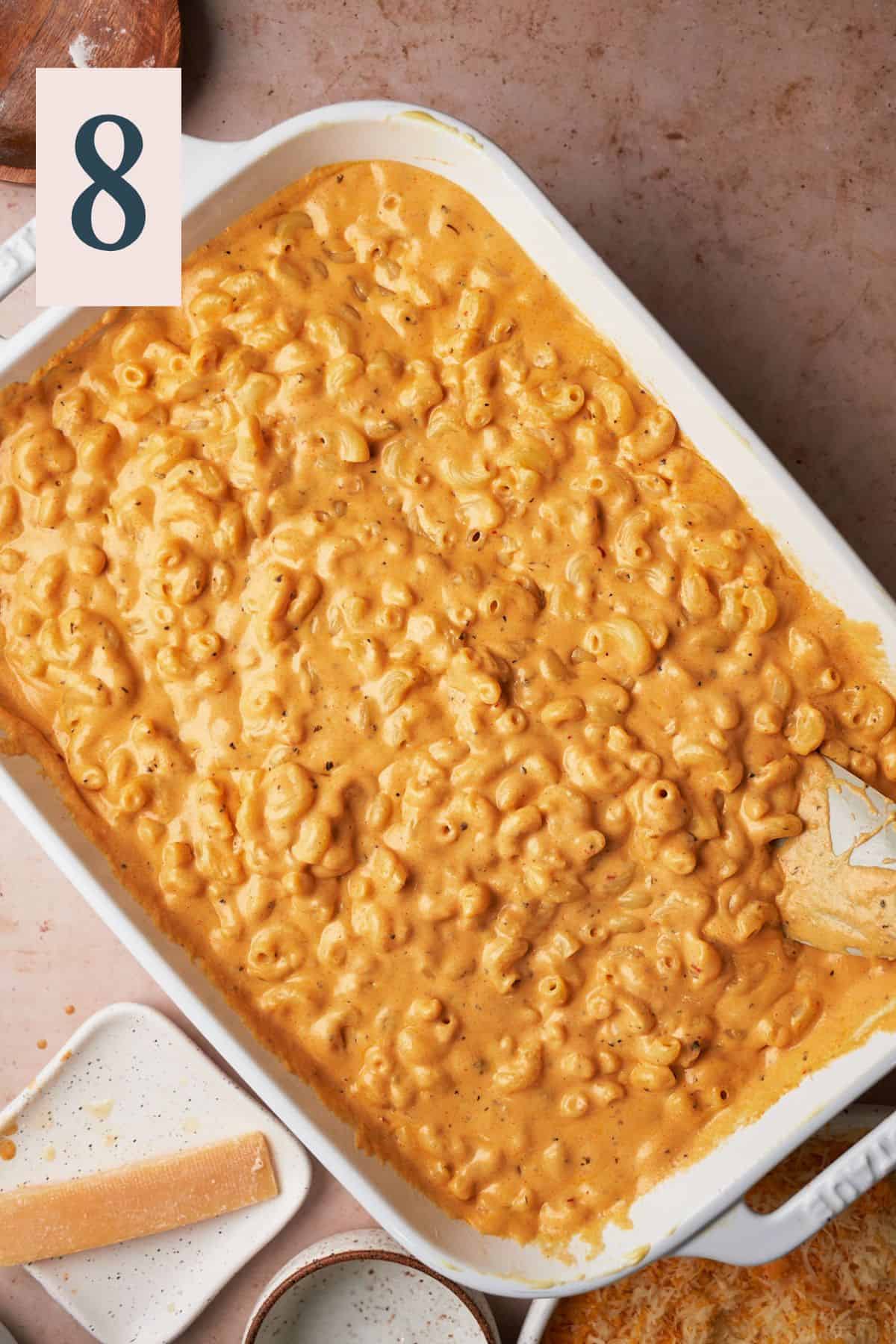 Macaroni and cheese sauce well combined in a casserole dish.