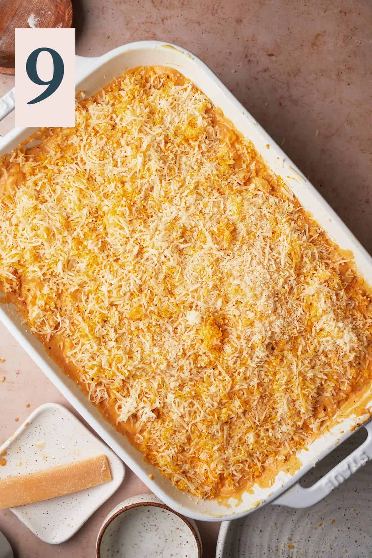 Cheese sauce and macaroni topped with remaining cheese before being baked.