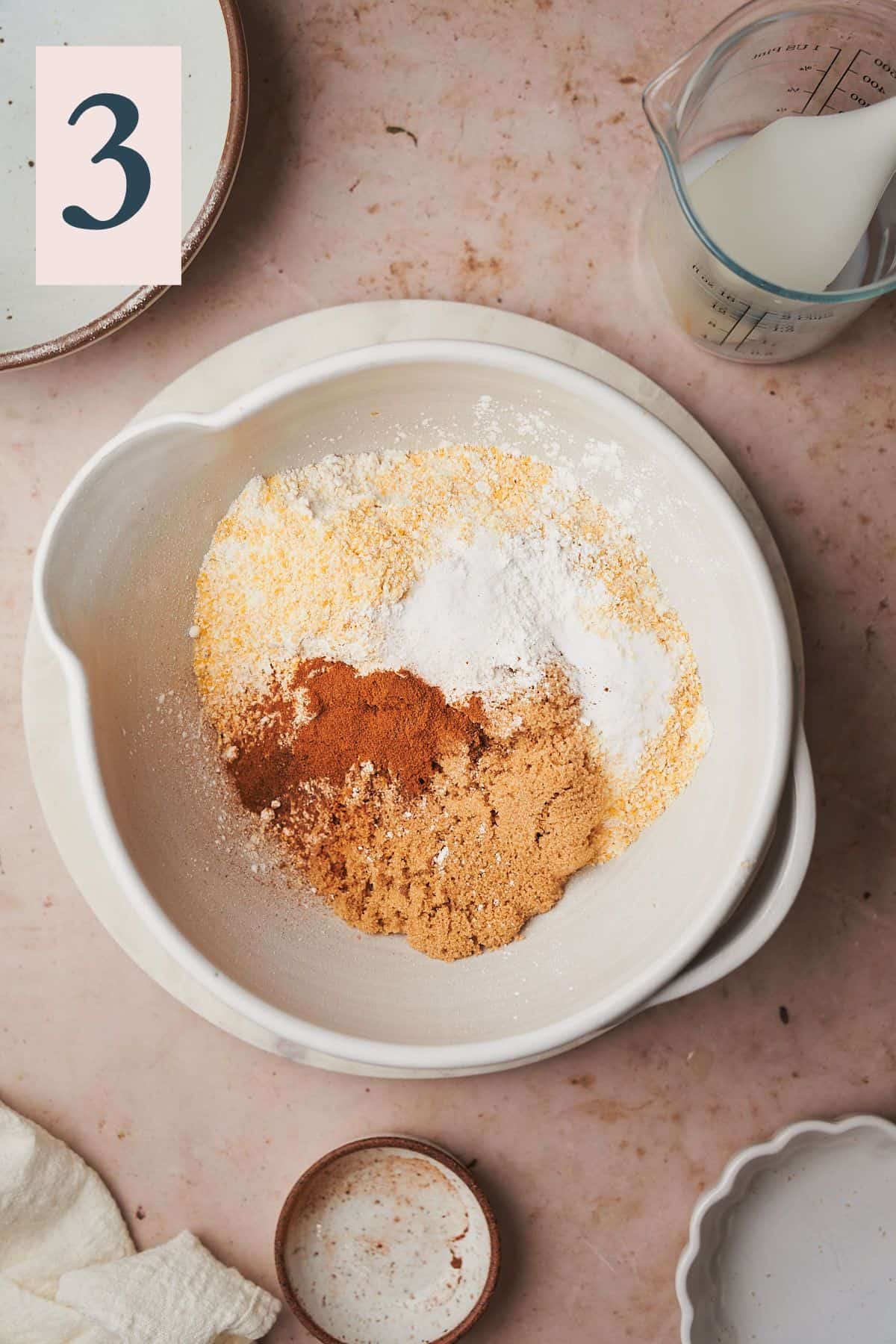 cornmeal, brown sugar, spices and flour in a bowl. 
