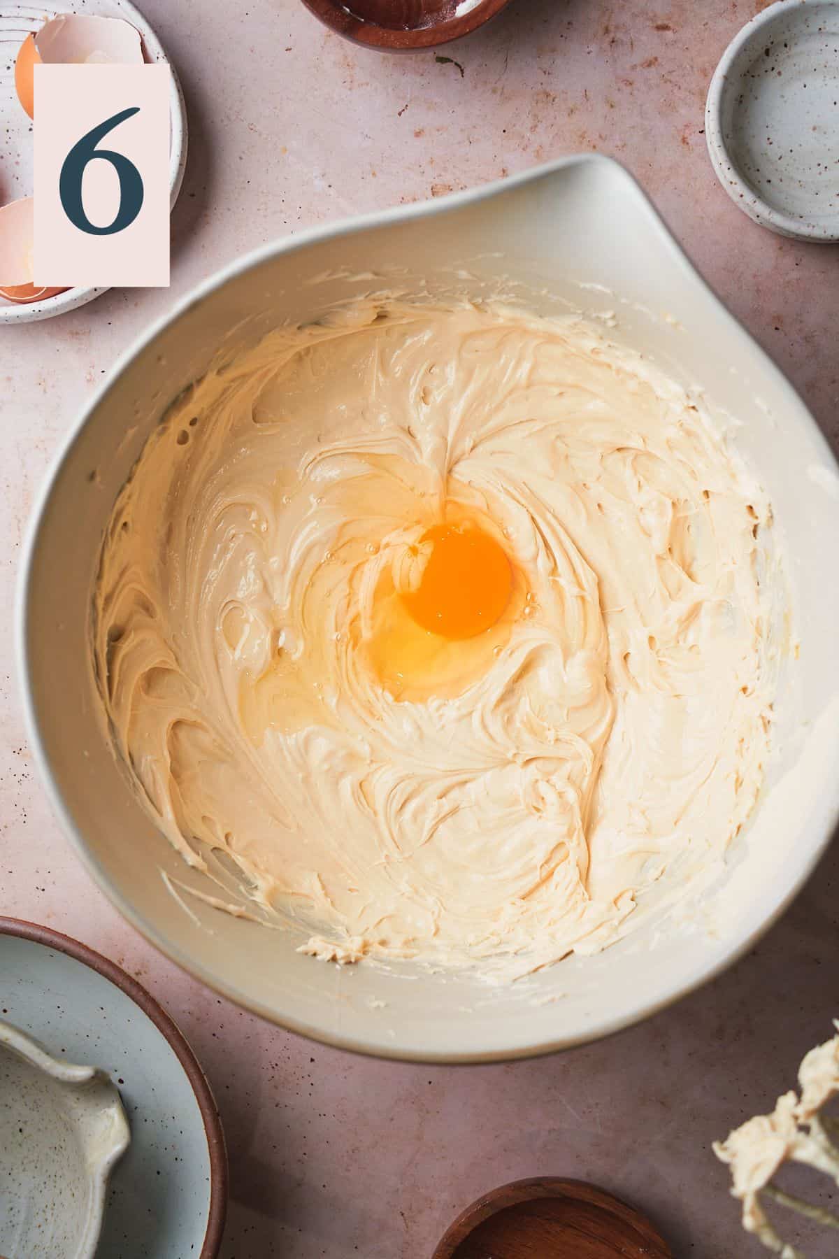 cheesecake batter with an egg in the mixture. 