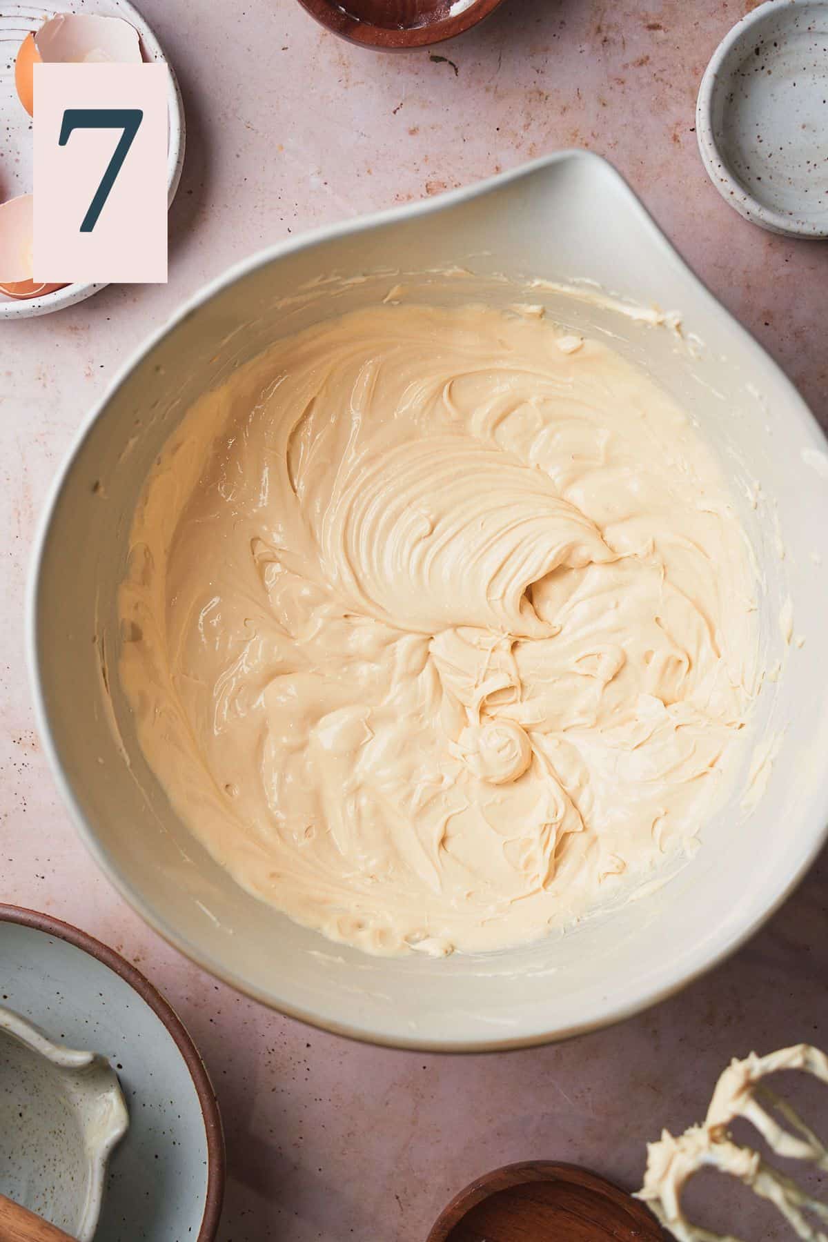 smooth and creamy cheesecake batter in a mixing bowl. 