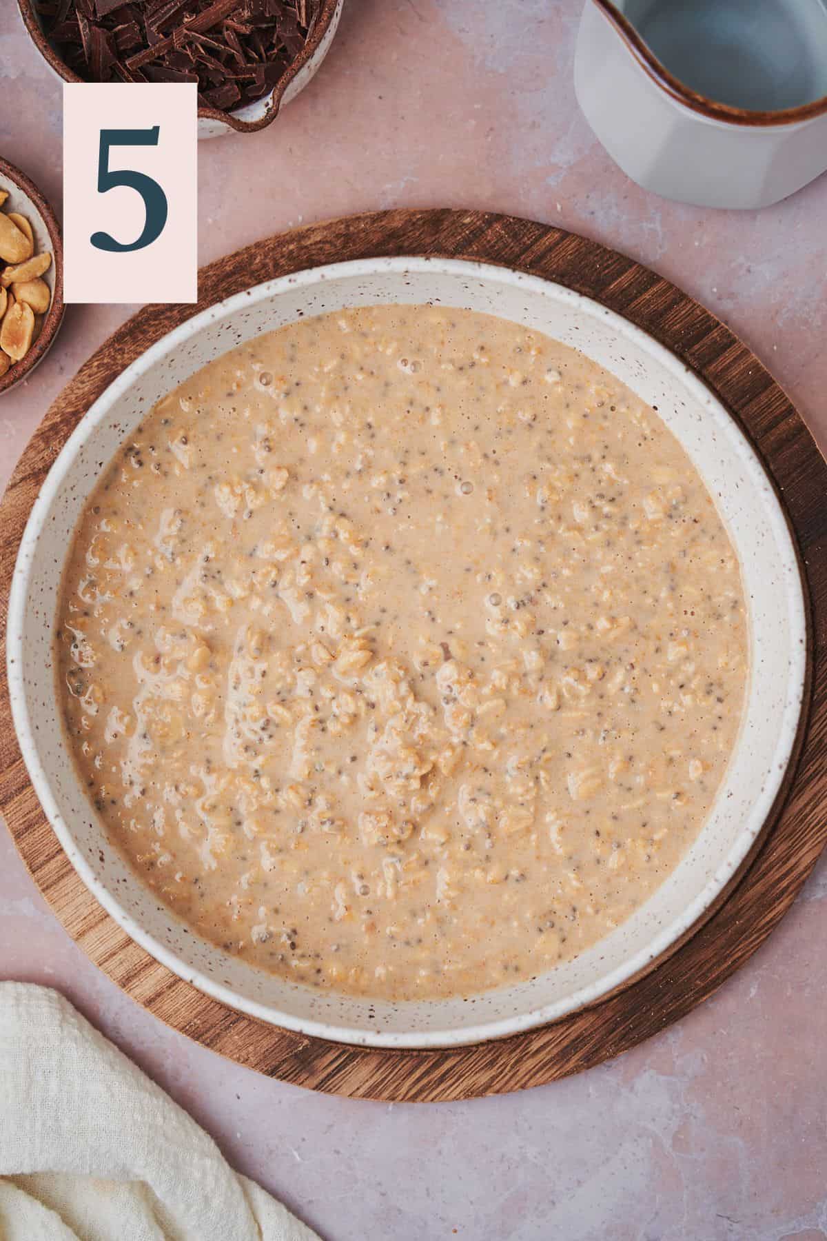 creamy overnight oats mixture in a large bowl.