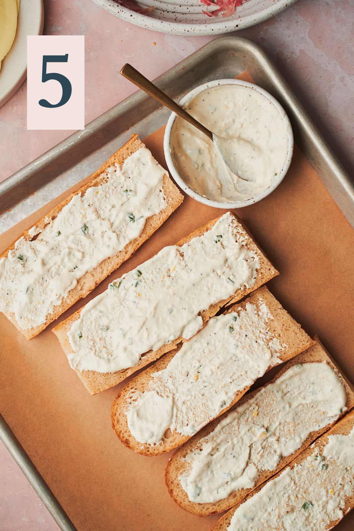 baguette slices slathered with horseradish sauce on all sides.