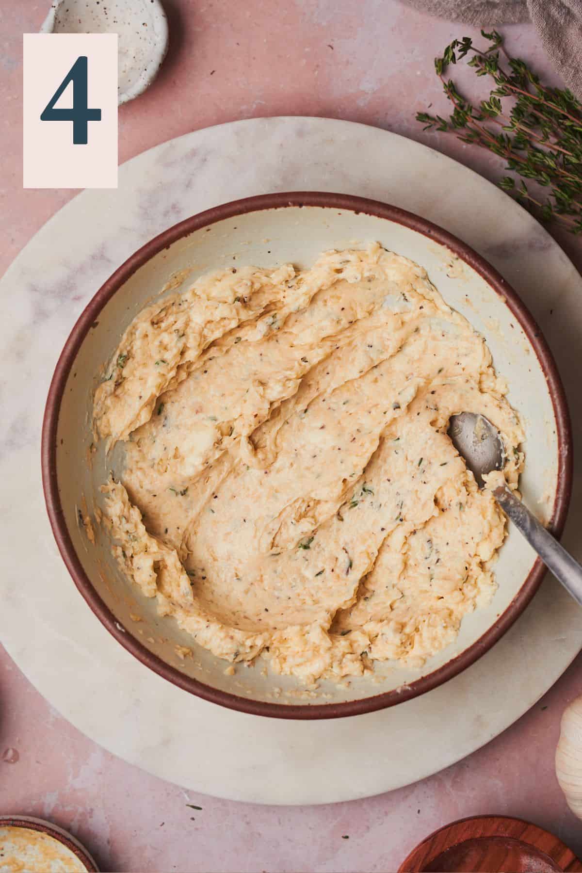 compound herb butter mixed together in a bowl. 