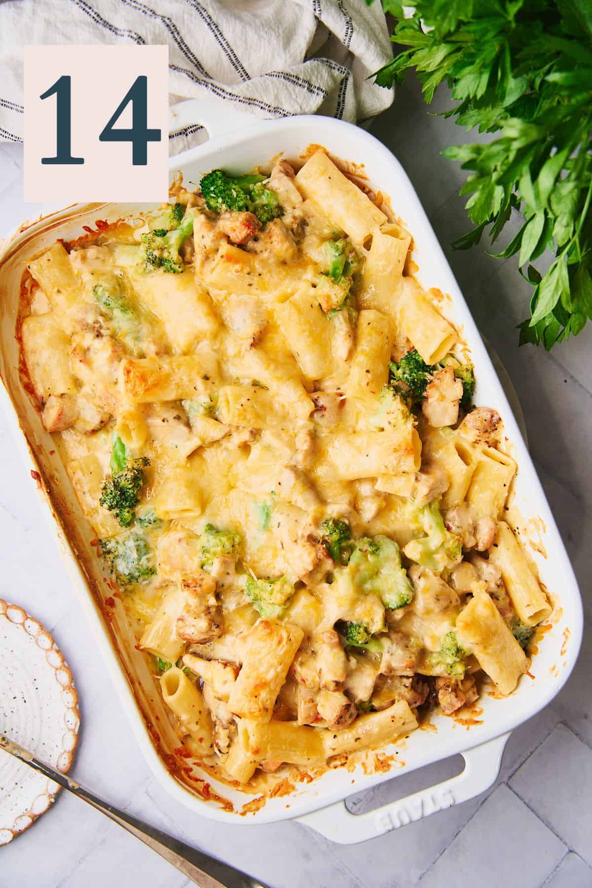 cheesy chicken and broccoli pasta in a casserole dish. 