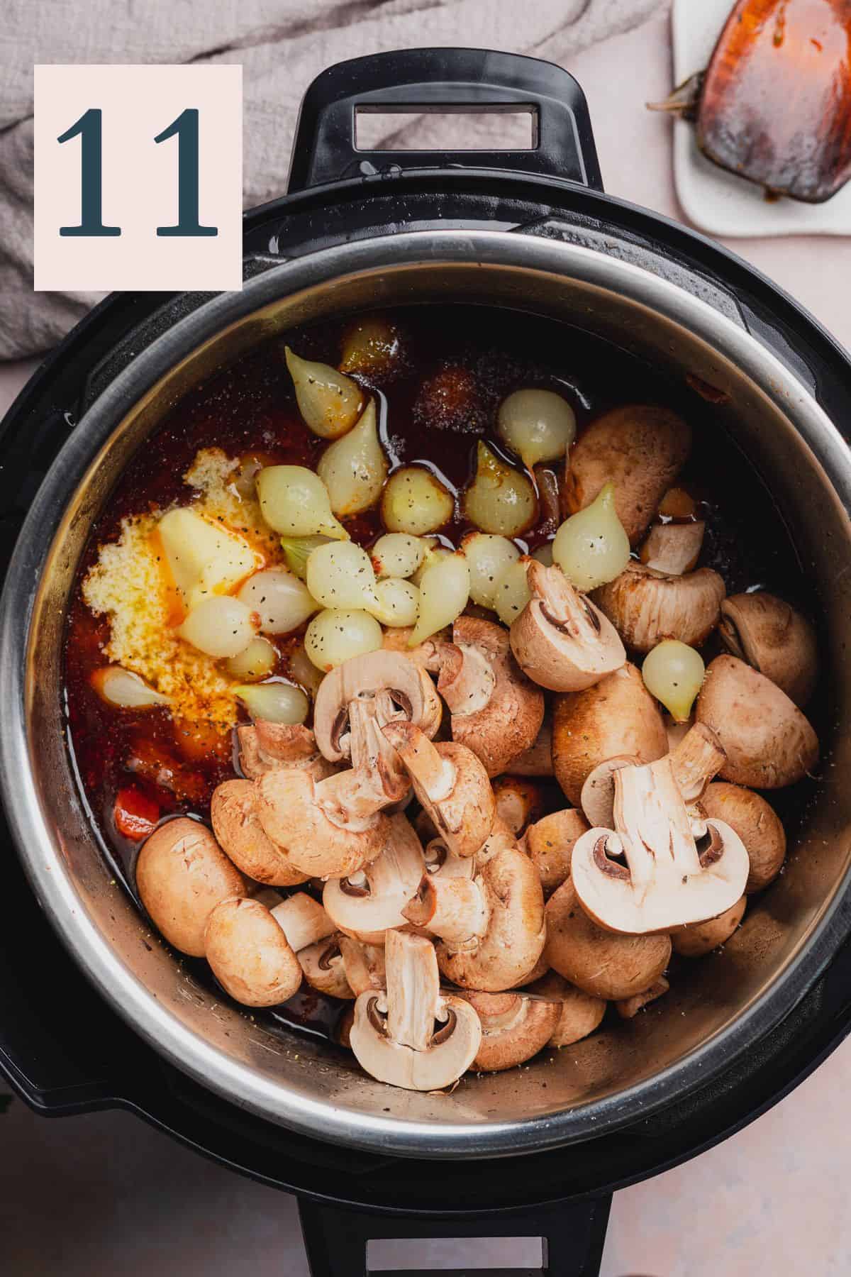 raw mushrooms and pearl onions in a pressure cooker.