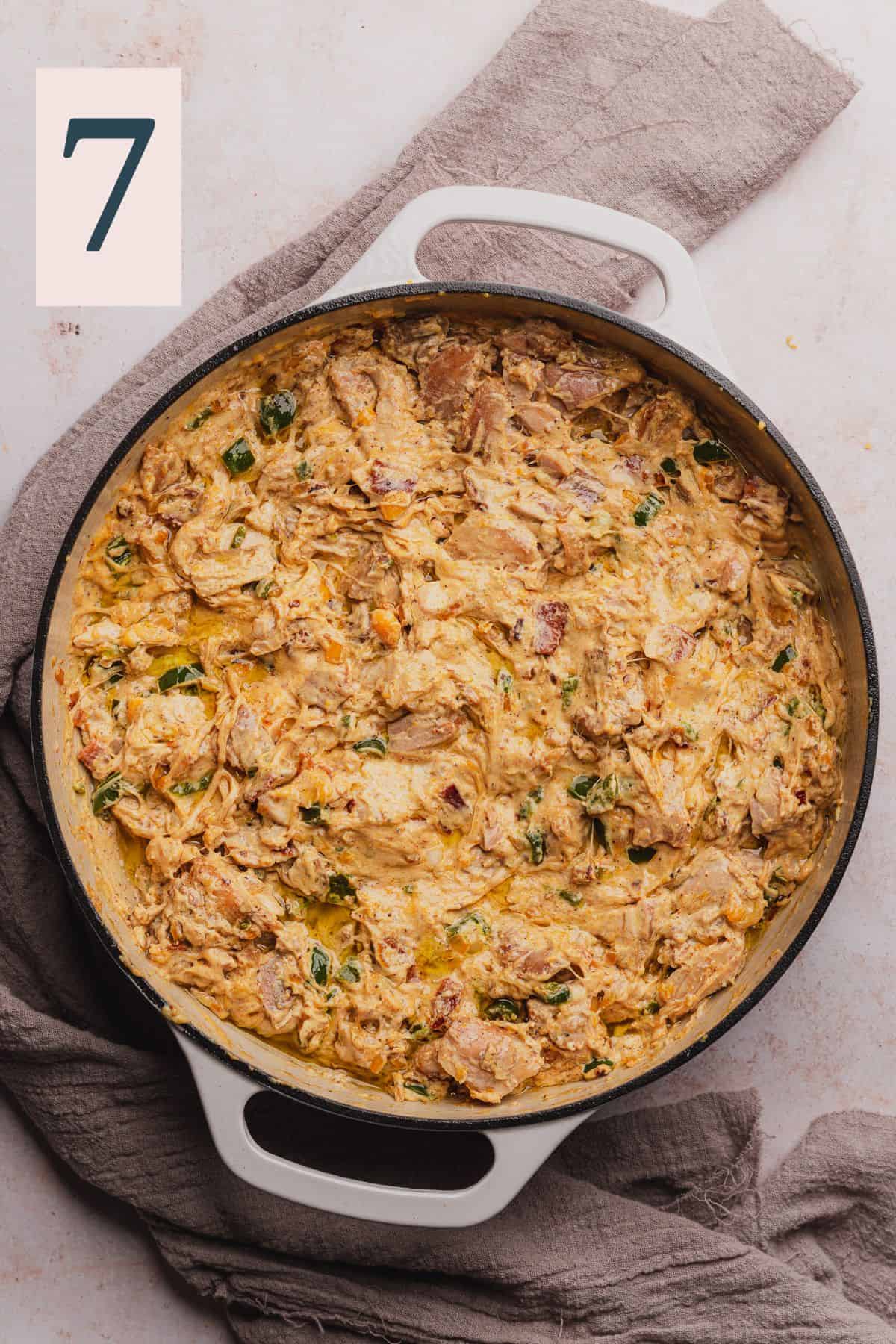 creamy chicken and jalapenos with bacon in a skillet.