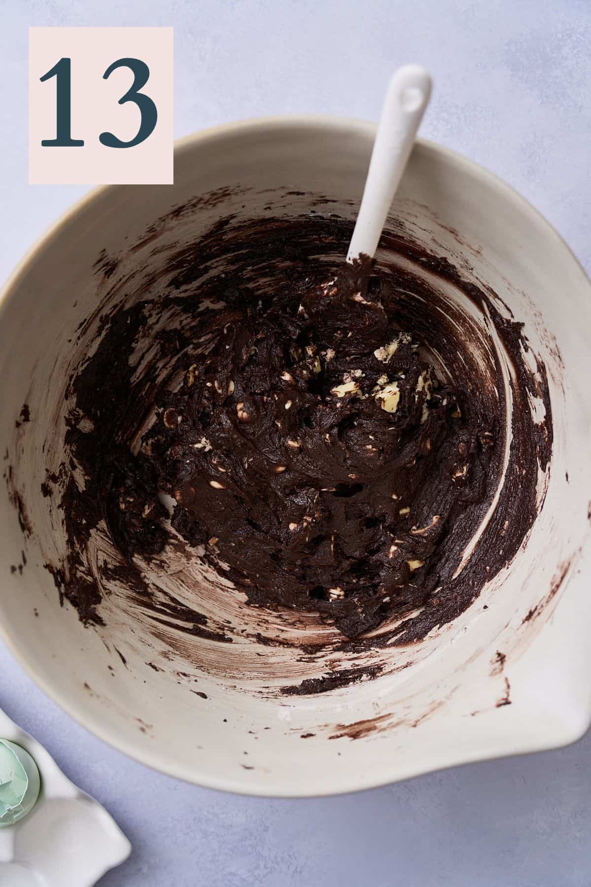 dark cocoa cookie dough mixed in a large bowl. 