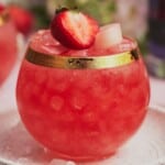 Rhubarb gin cocktail with strawberries.