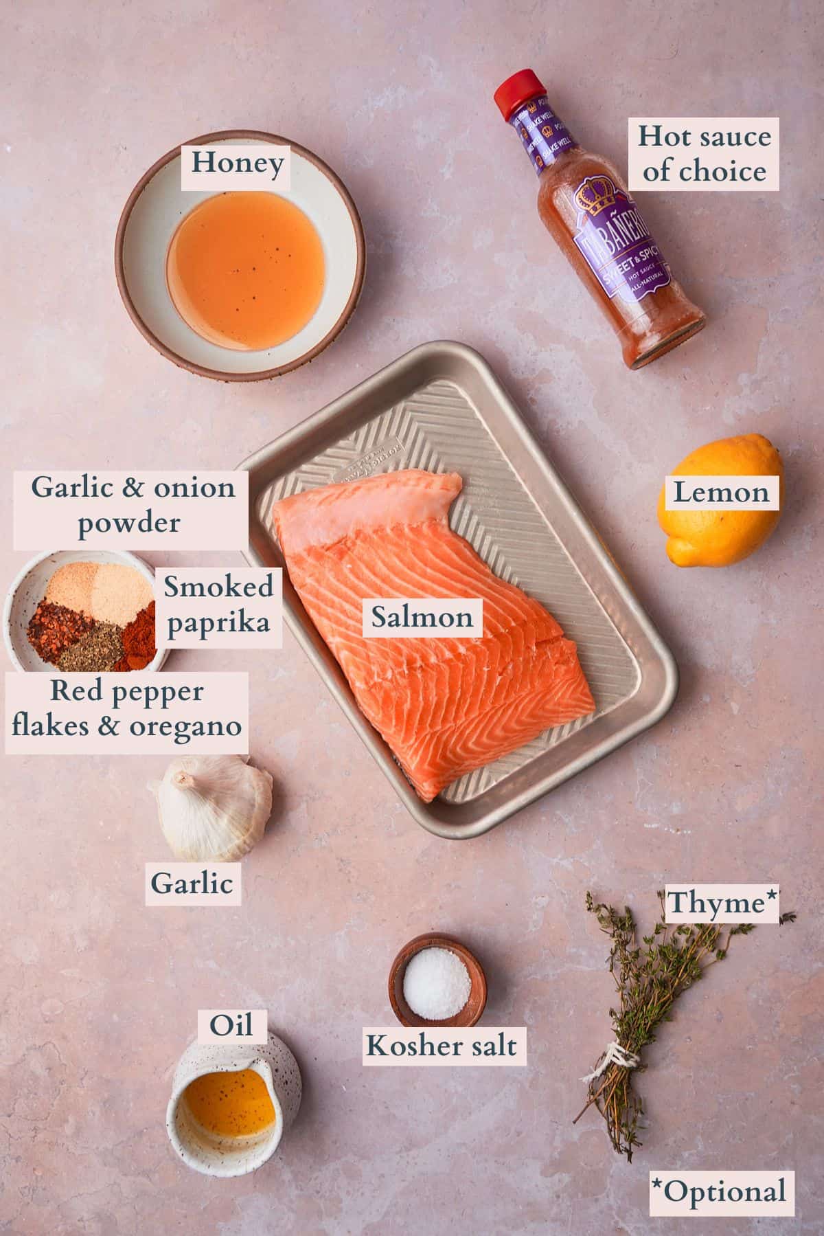 Sweet and spicy salmon bite ingredients laid out on a table and labeled to denote each ingredient. 