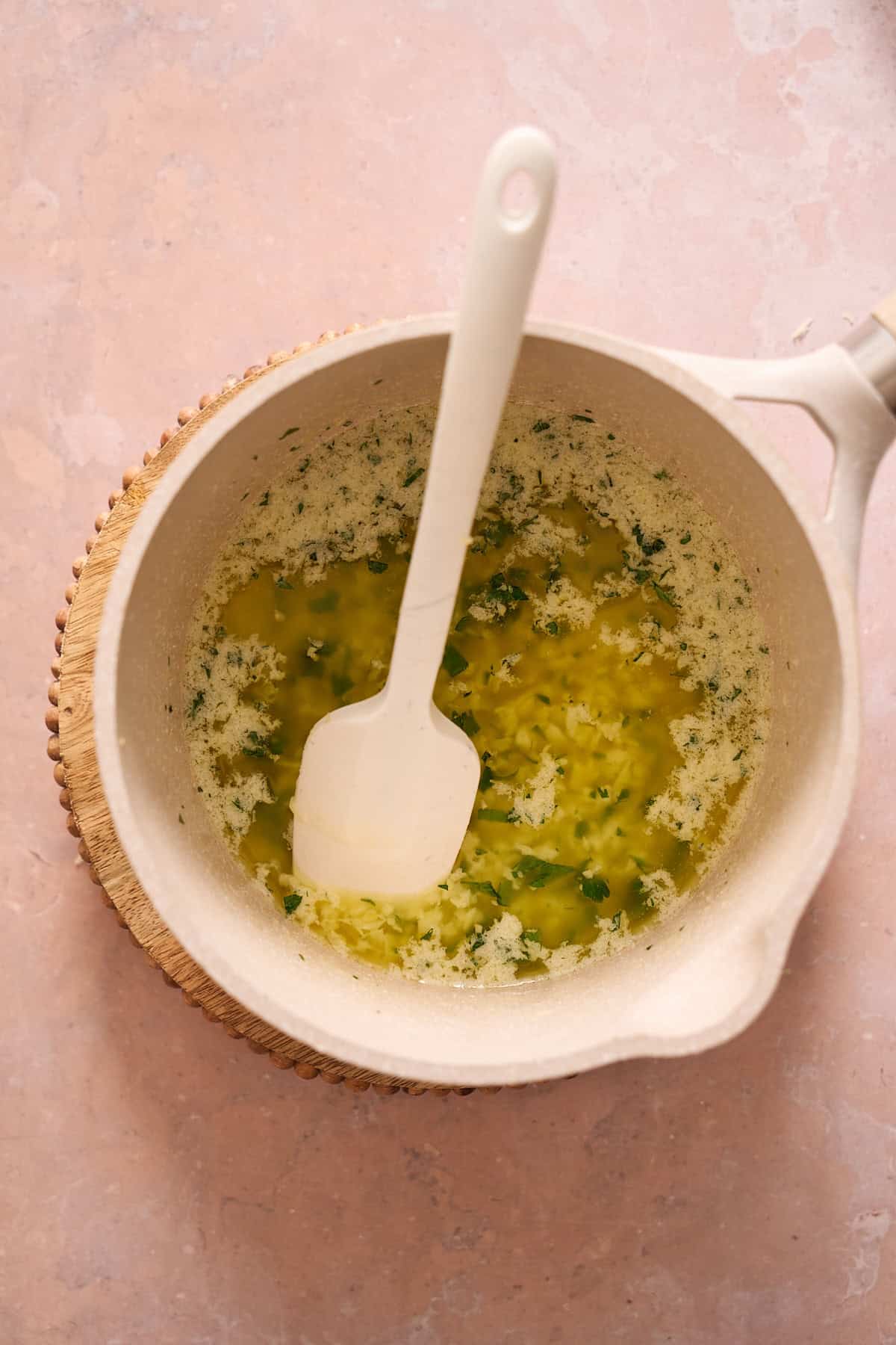 Garlic butter sauce in a saucepan. 