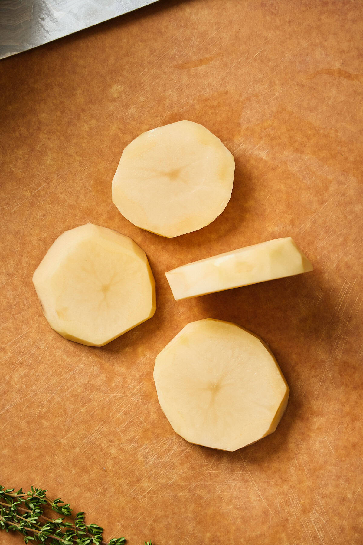 Even size thick slabs of potatoes about 1-inch thick.