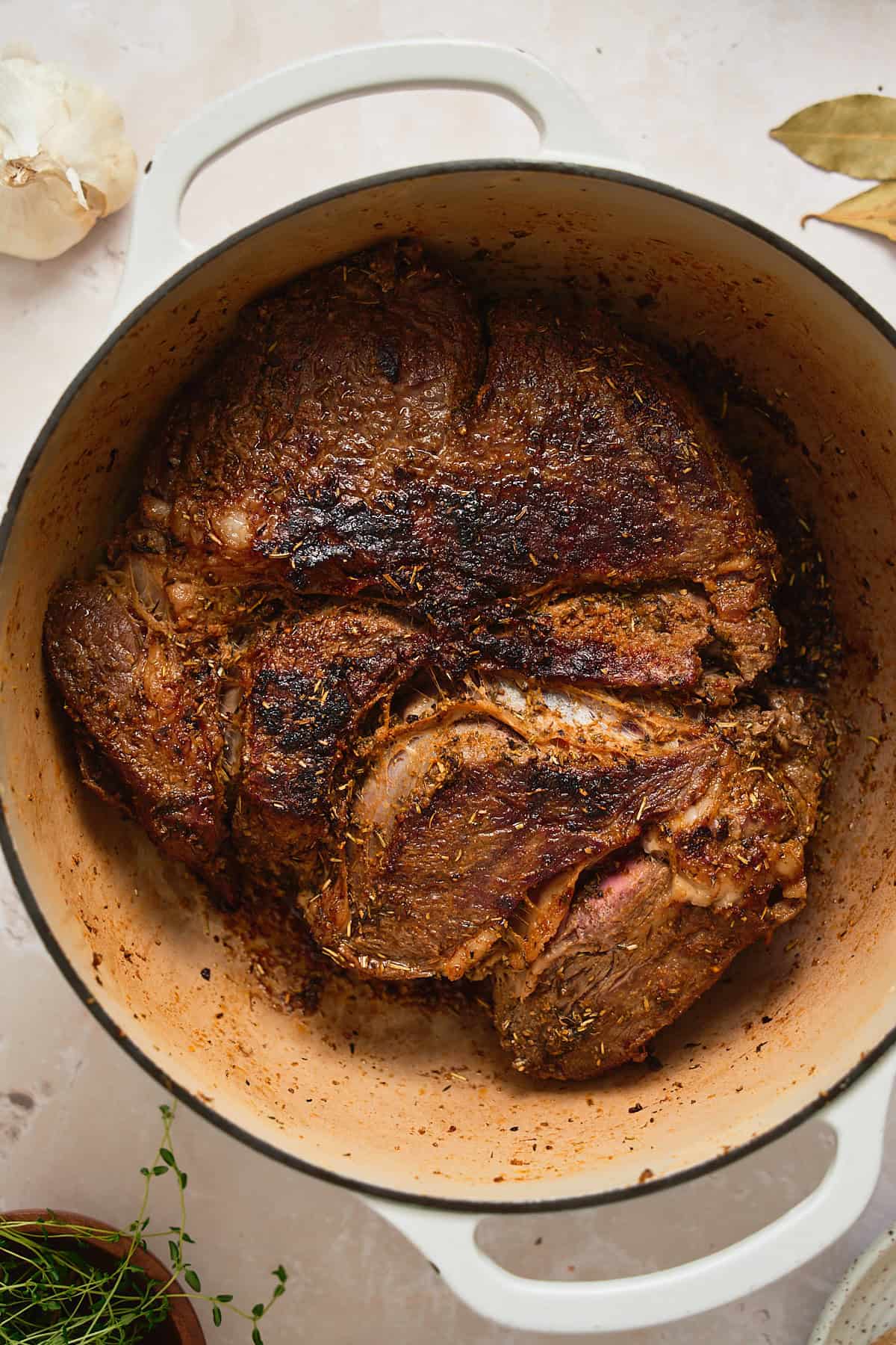 Chuck roast being browned in a Dutch oven.