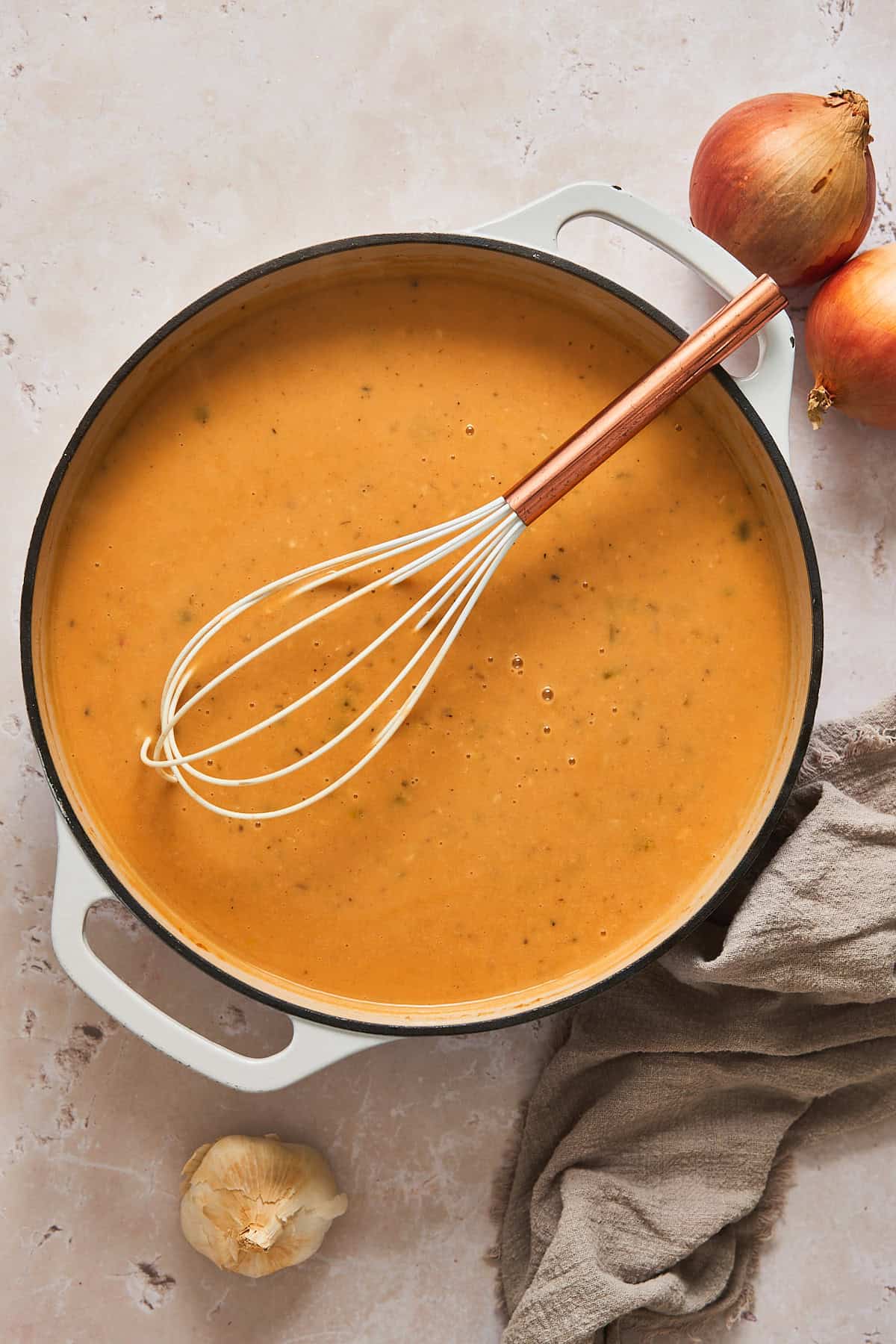 Cream that has been added to the chicken and turkey pan gravy with a whisk.