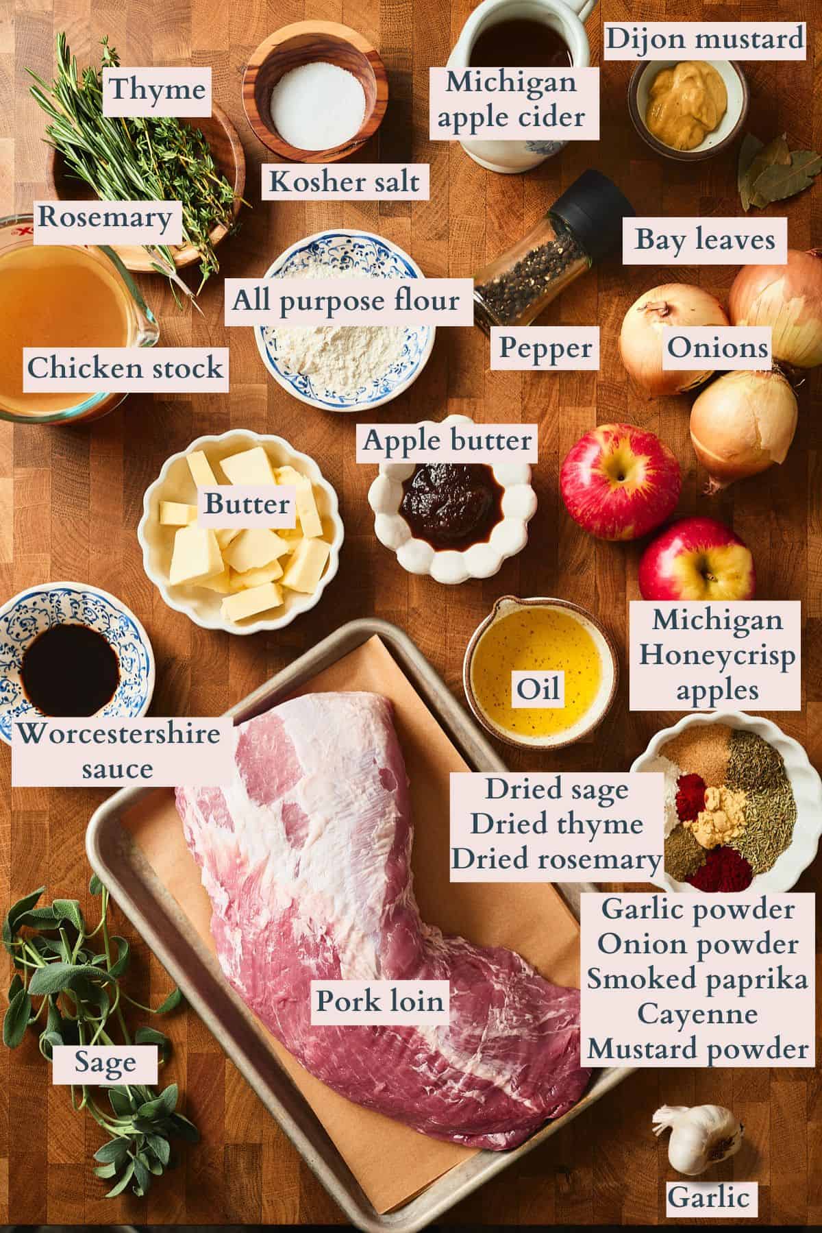Ingredients to make an apple stuffed pork loin laid out on a table and labeled to denote each ingredient.