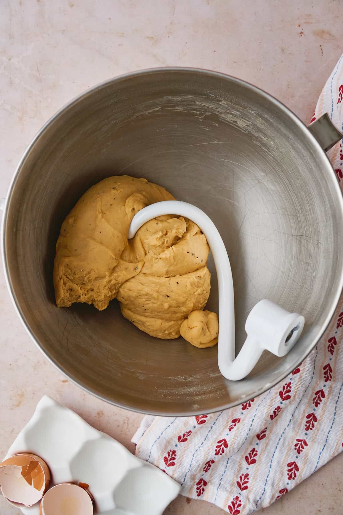 Soft, pliable dough formed in a stand mixer with a dough hook attached to it.