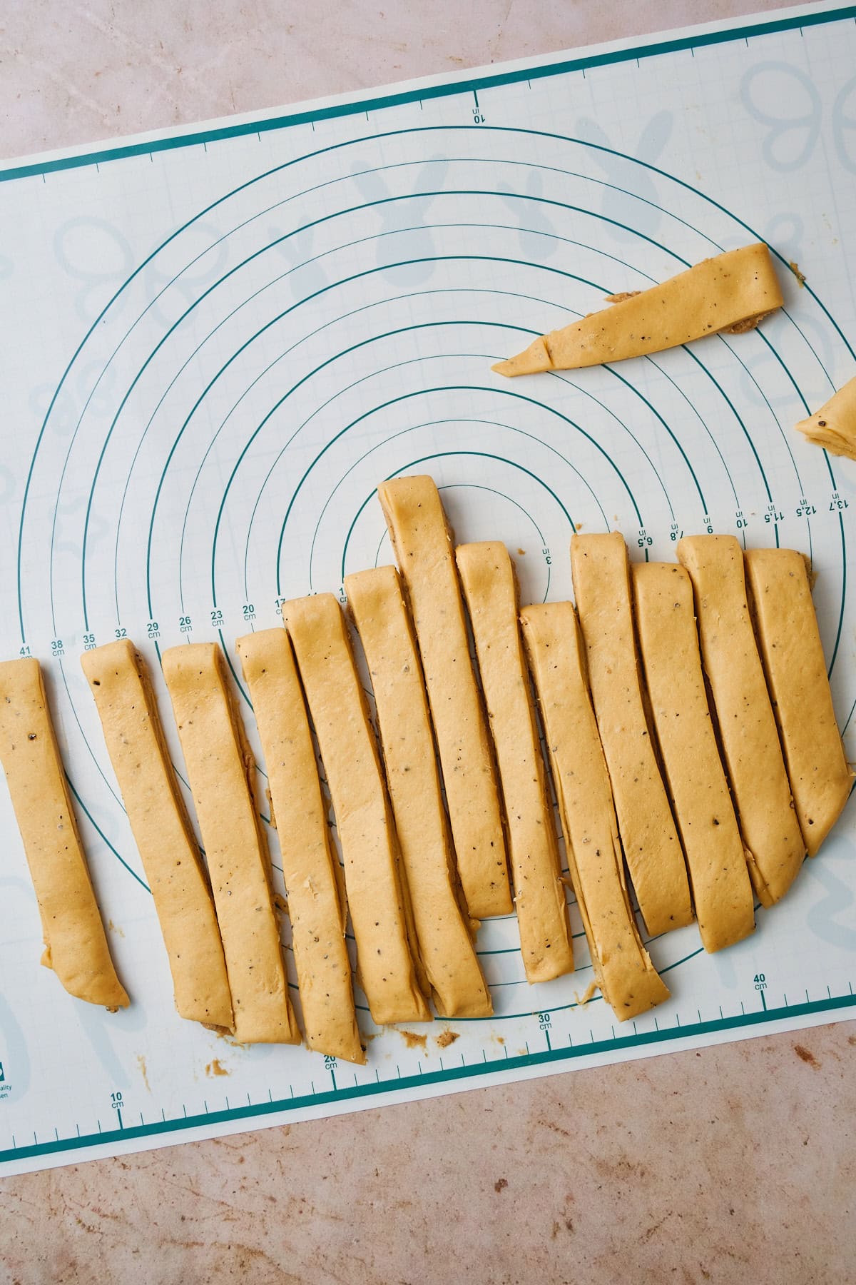 13 strips of dough cut to form knots.