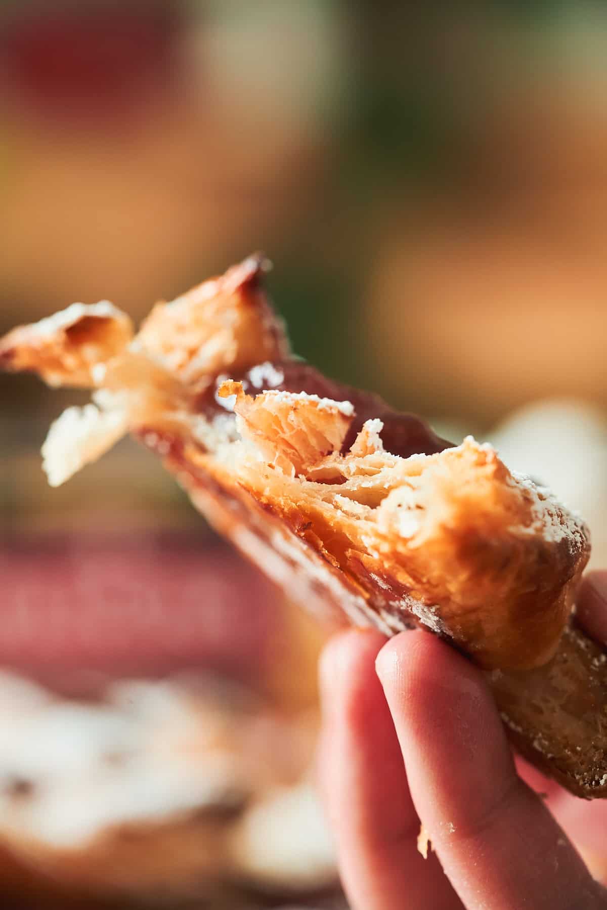 Close up shot showing incredible flakiness of puff pastry when baked.