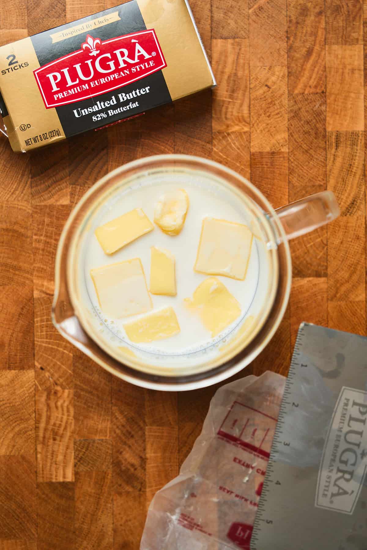 Cold milk and butter in a container.