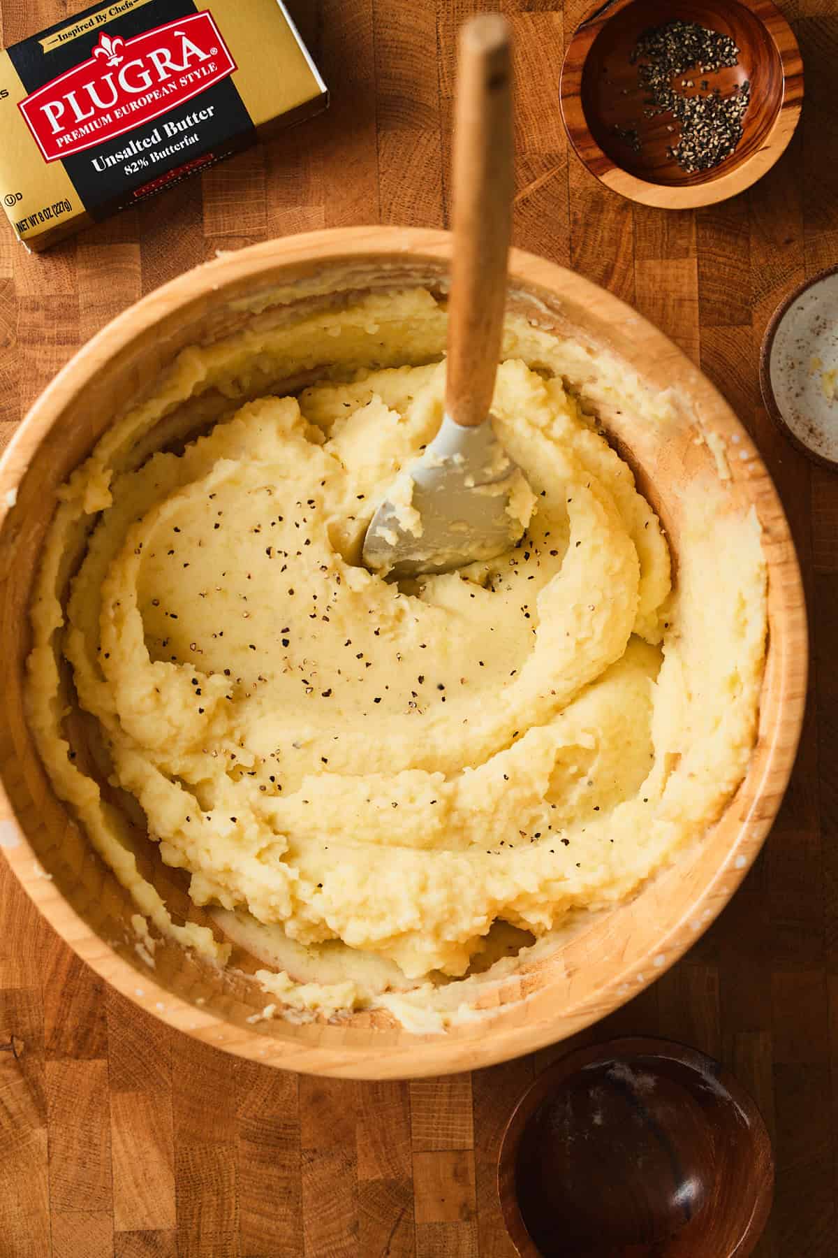 Swedish mashed potatoes in a large bowl with a rubber spatula.