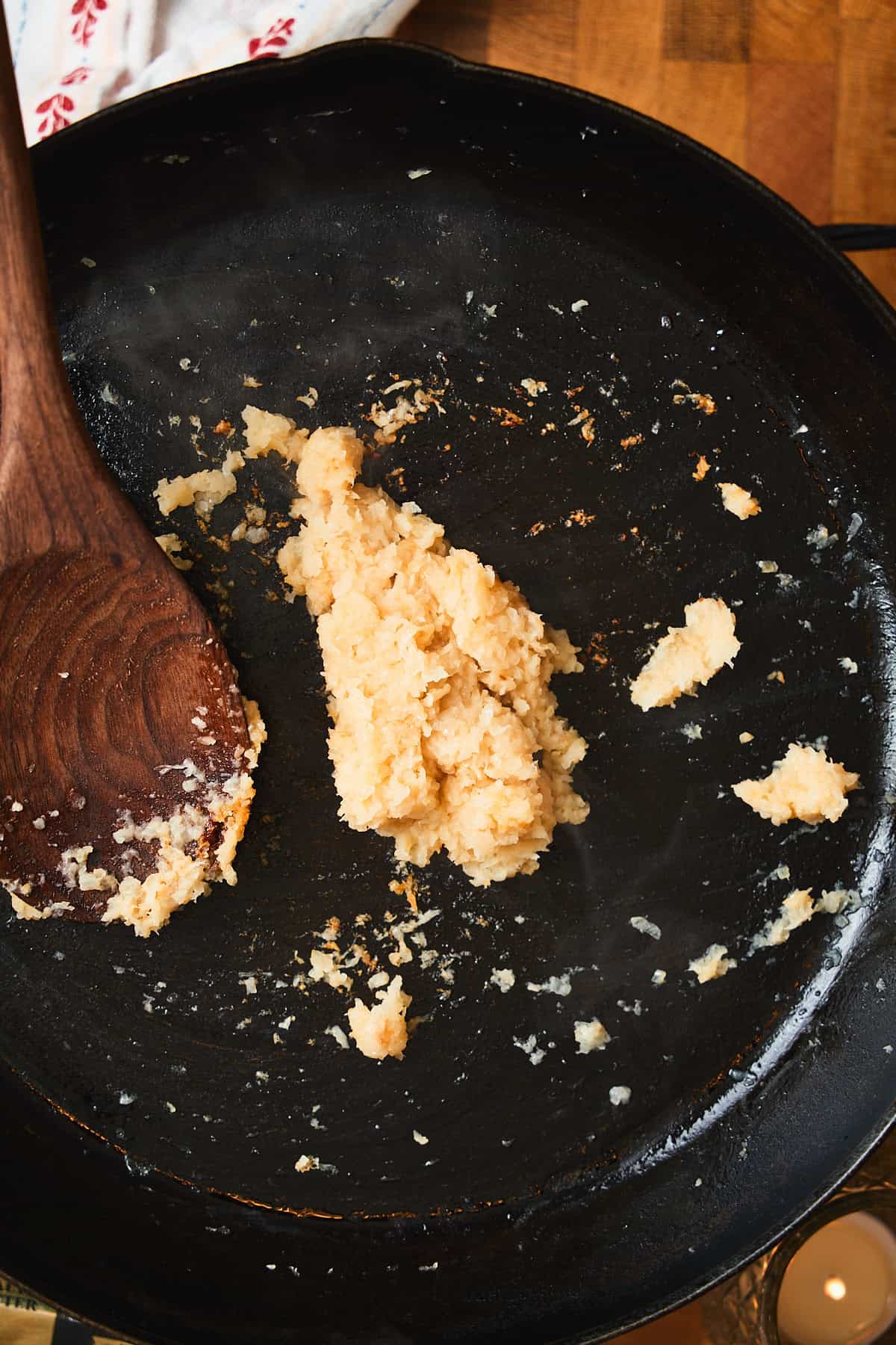 Browned grated onions in a skillet.