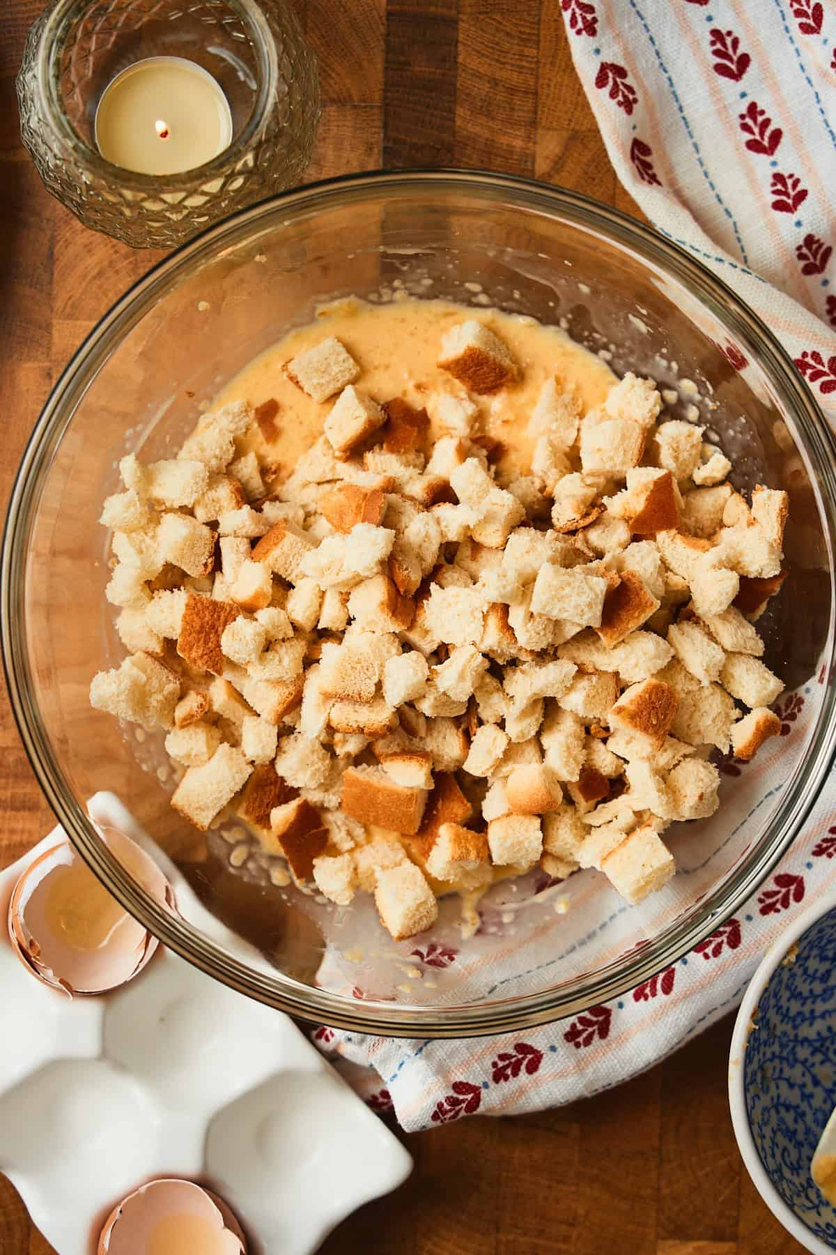 Bread pieces in an eggs and cream mixture to make a panade.