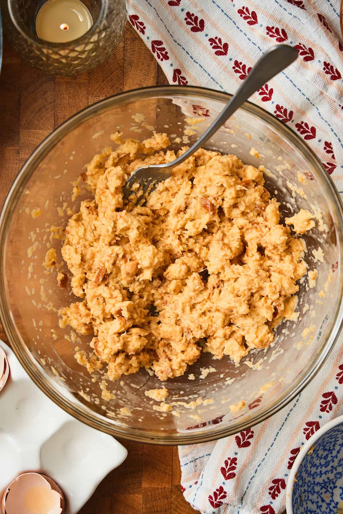 Mushy eggs, milk and bread pieces in a bowl known as a panade.