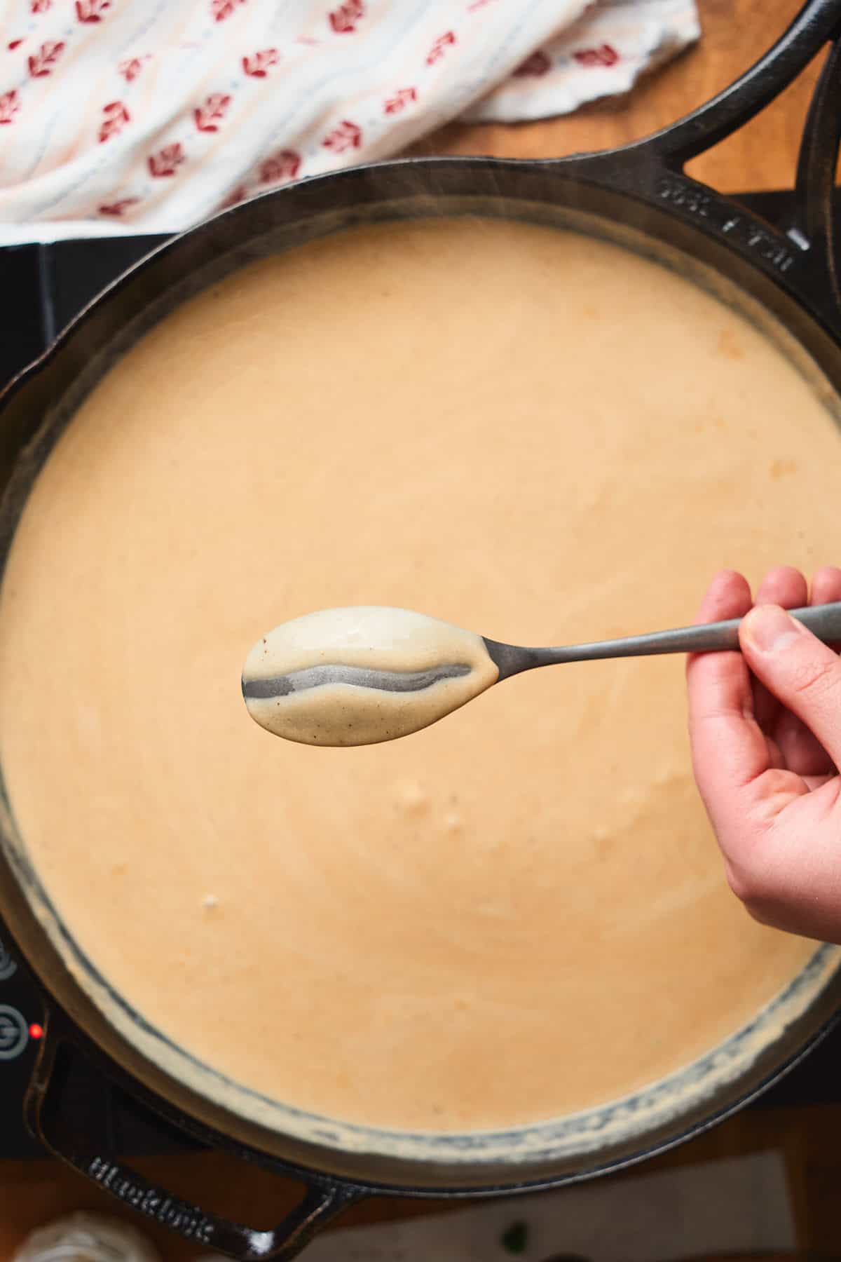Thick gravy coating the back of the spoon.
