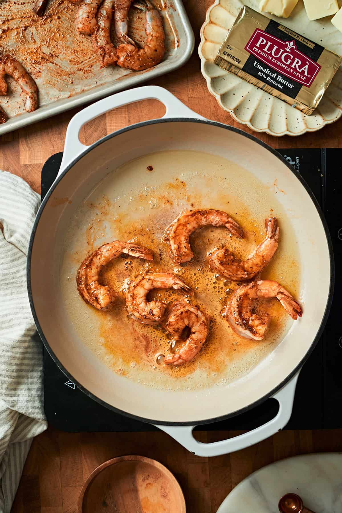Cooked shrimp in a skillet.