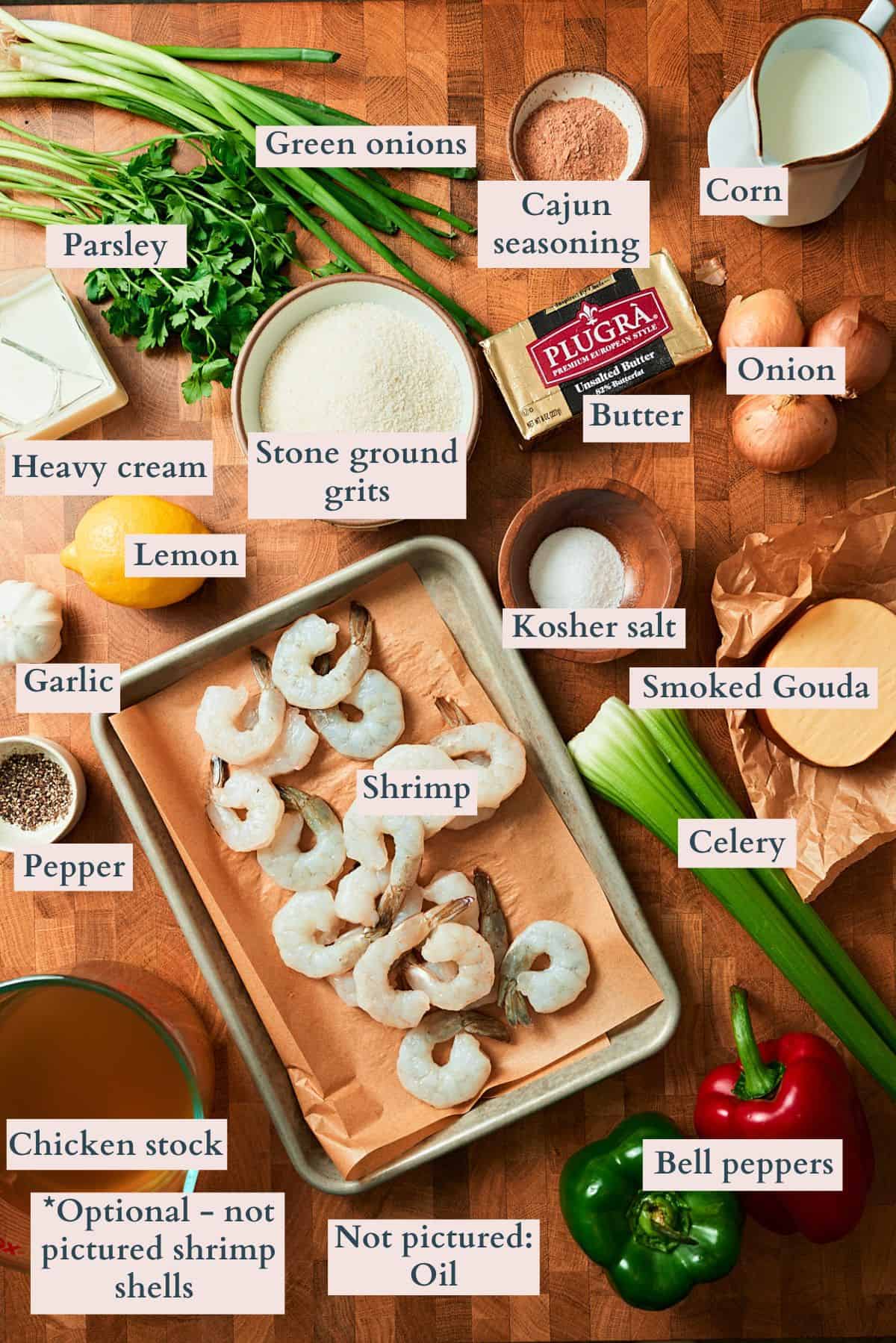 Ingredients to make cajun shrimp and grits laid out on a table and labeled to denote each ingredient.