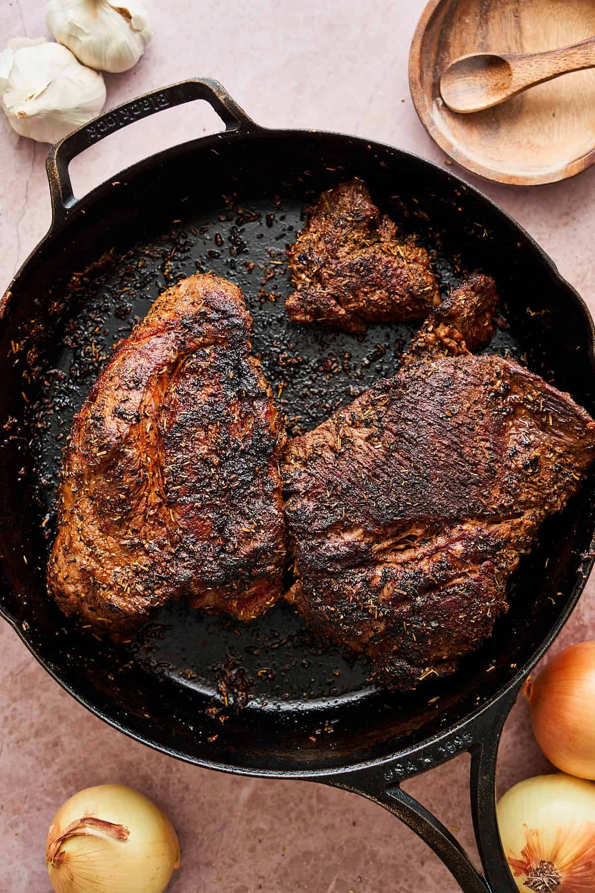 Browned chuck roast in a skillet.