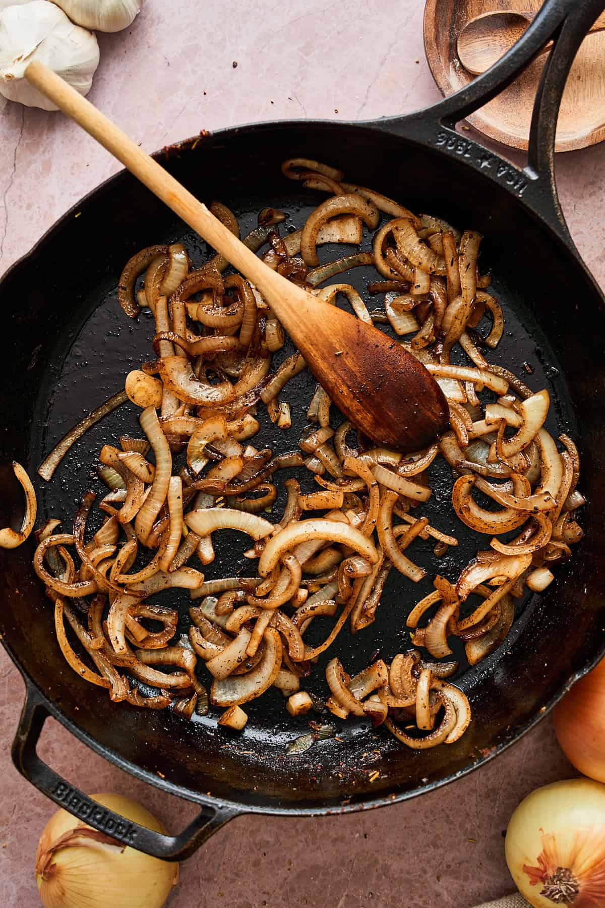 Cooked onion slices that are beginning to brown.