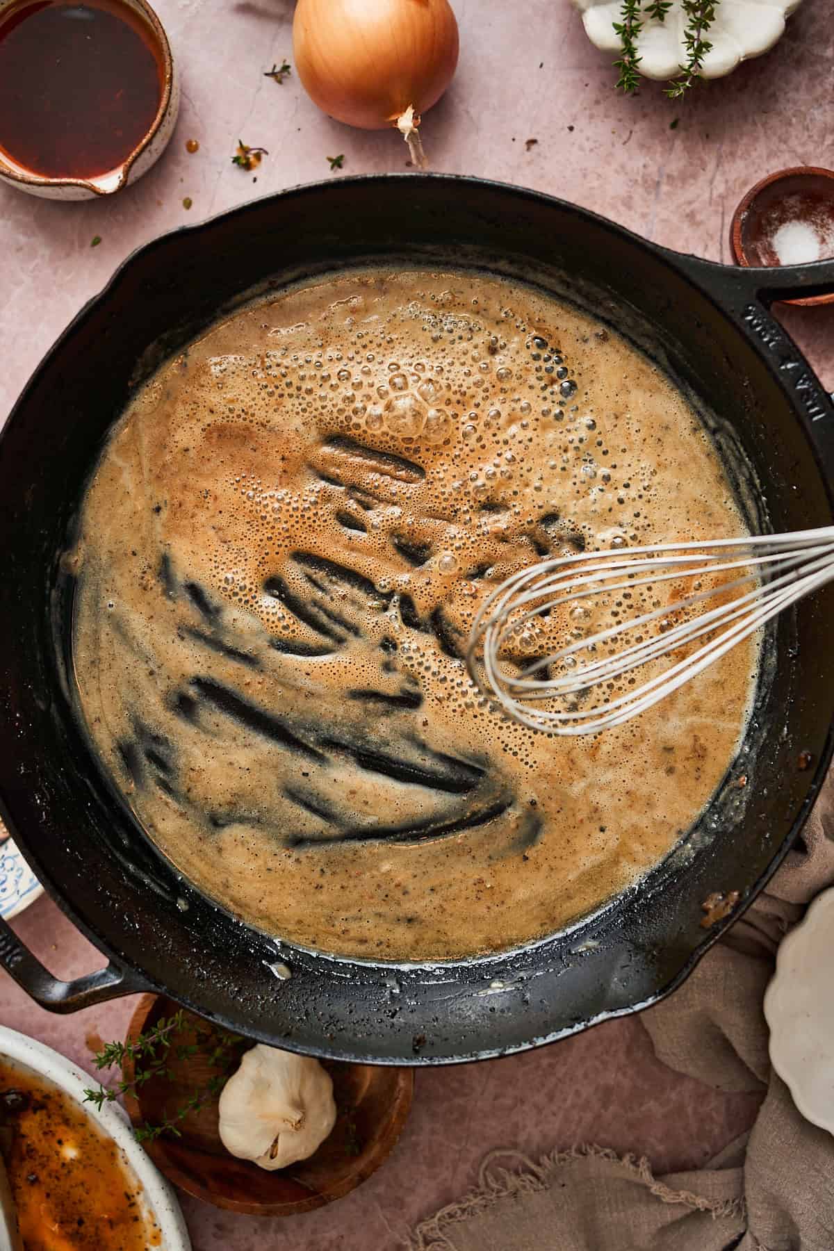Golden brown butter in a pan with flour with pan drippings to make a gravy.