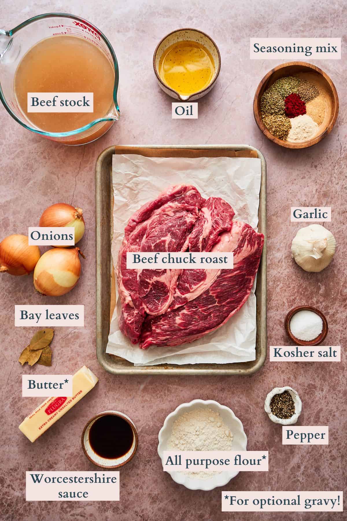 Ingredients laid out on a table to make a beef chuck roast with gravy.