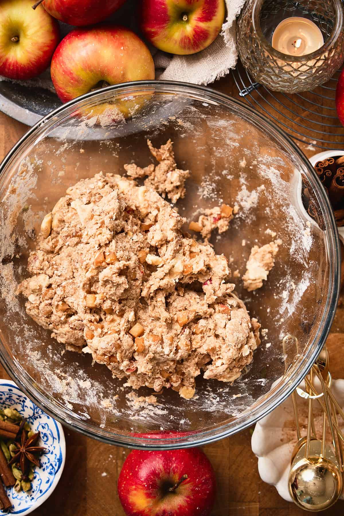 Warm spiced apple biscuit dough in a mixing bowl coming together.