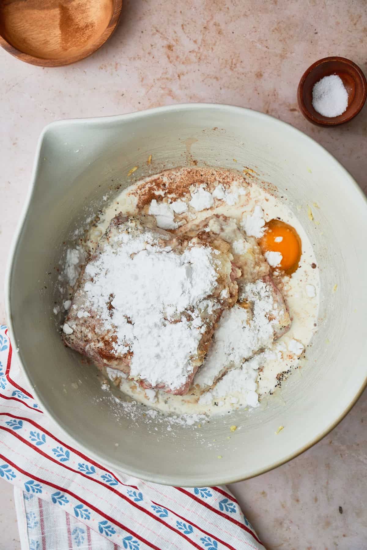 starch, eggs, cream, spices, and salt added to meat to make the meatball mixture.