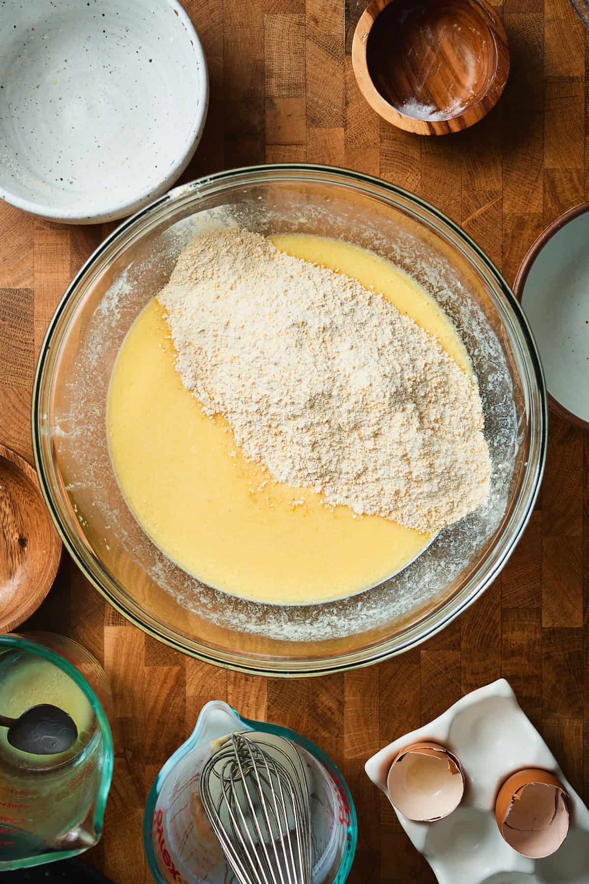 Dry ingredients added to wet to make cornbread.