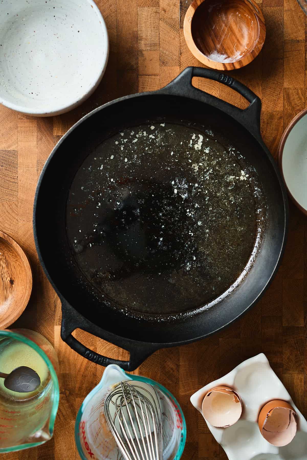 Melted butter in a hot cast iron skillet.