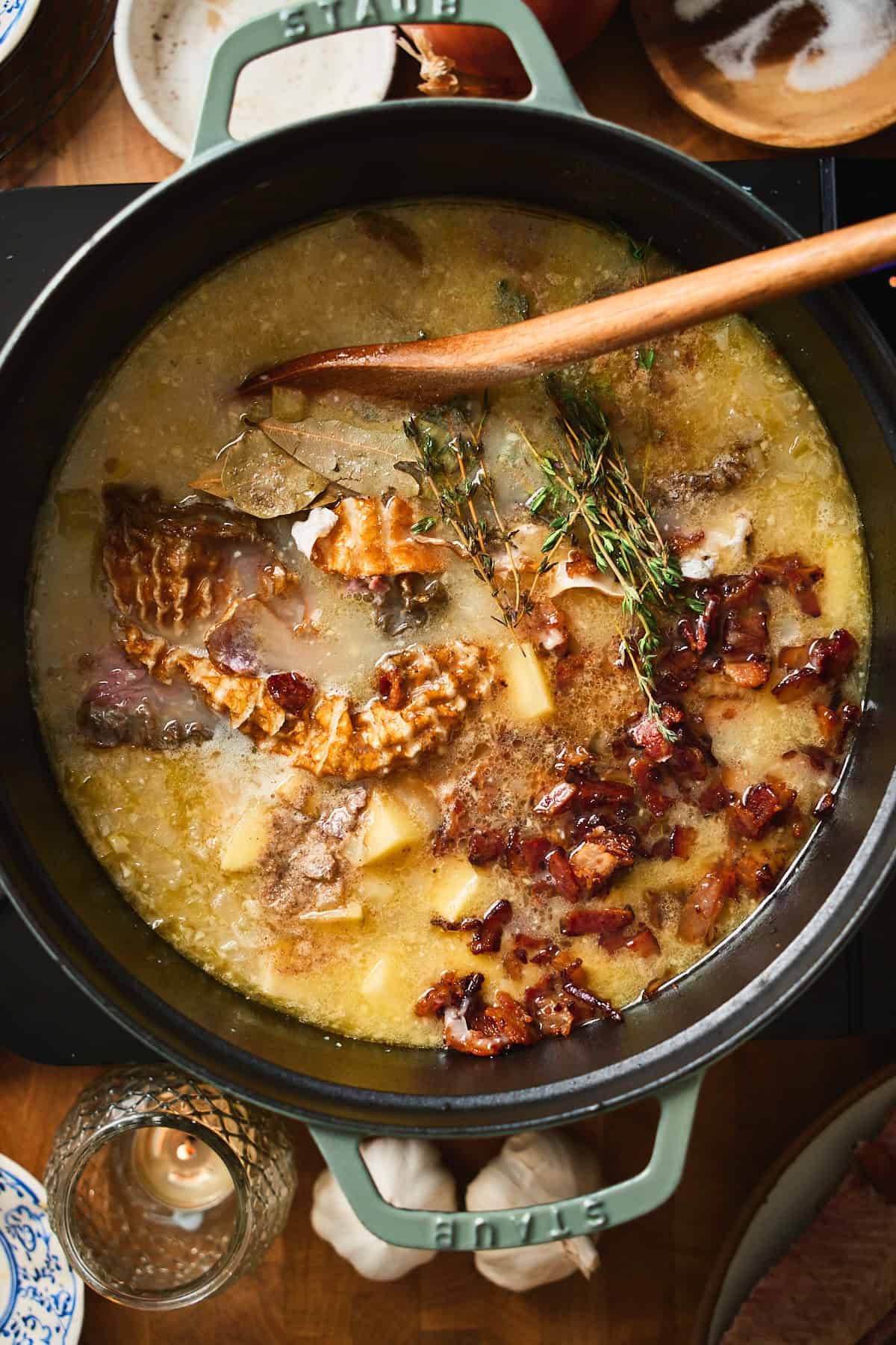 Chowder simmering with potatoes, bacon, smoked whitefish skin, bay leaves, and thyme.