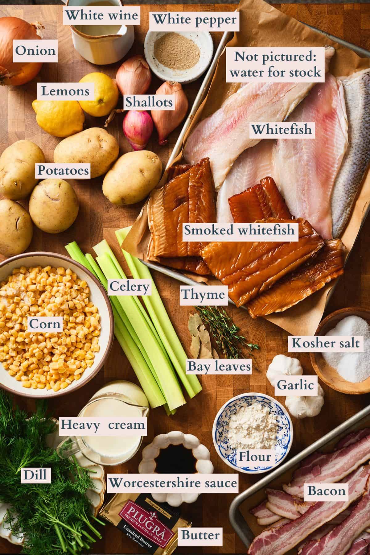 Labeled ingredients for whitefish chowder including fresh and smoked whitefish, bacon, potatoes, corn, celery, dill, cream, and seasonings.