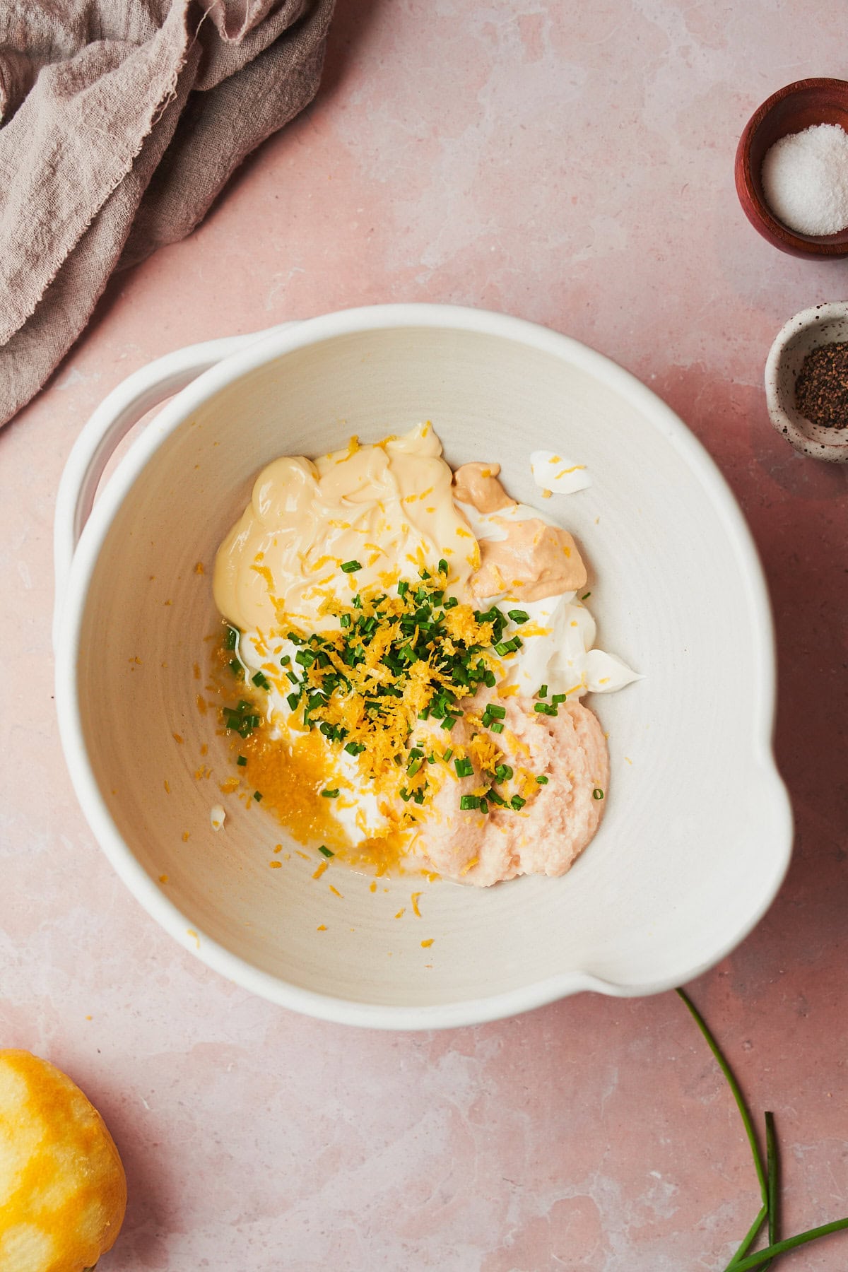 sour cream, mayo, chives, lemon zest, dijon mustard, vinegar, and horseradish in a bowl.