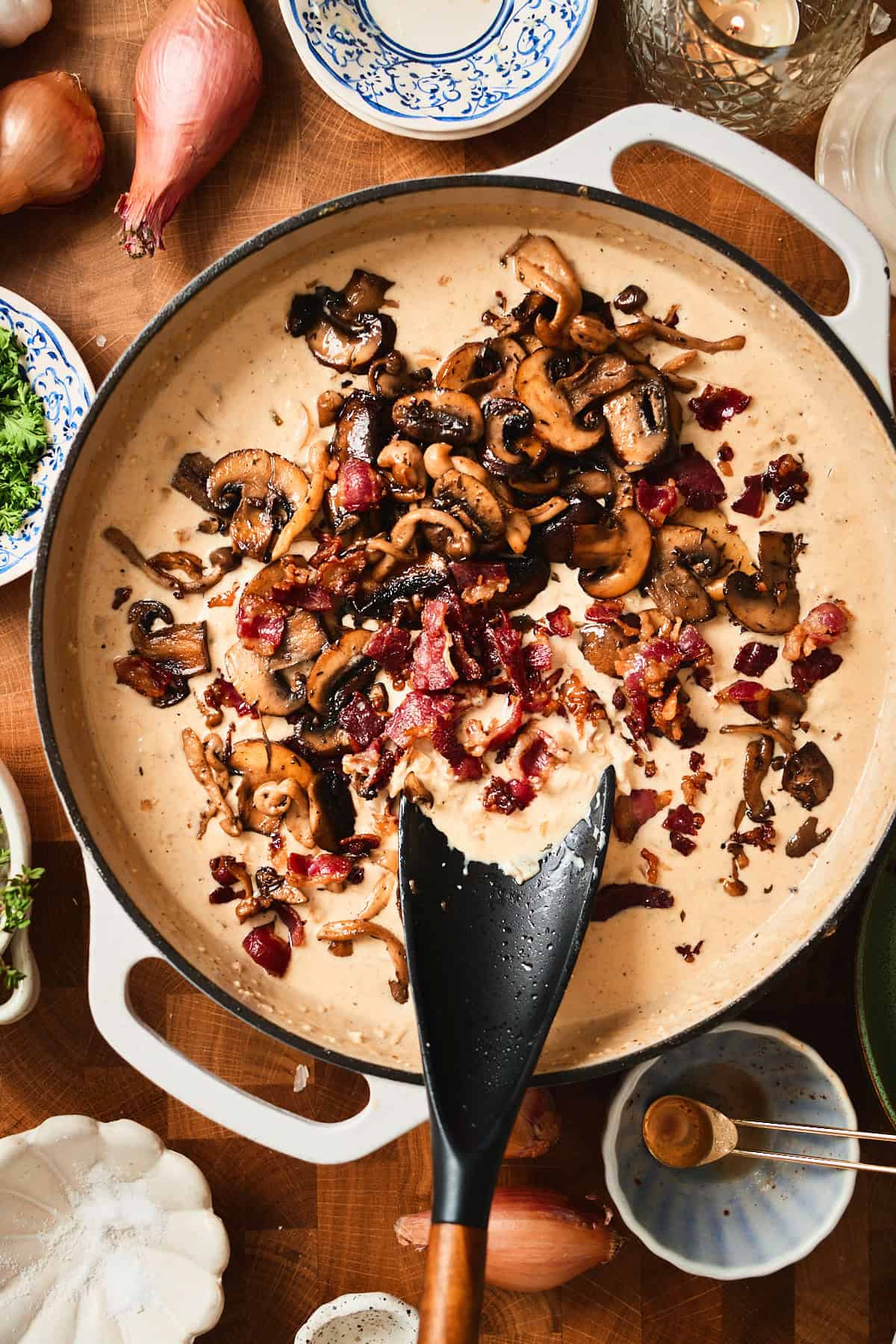 Bacon bits and mushrooms added to cream sauce.