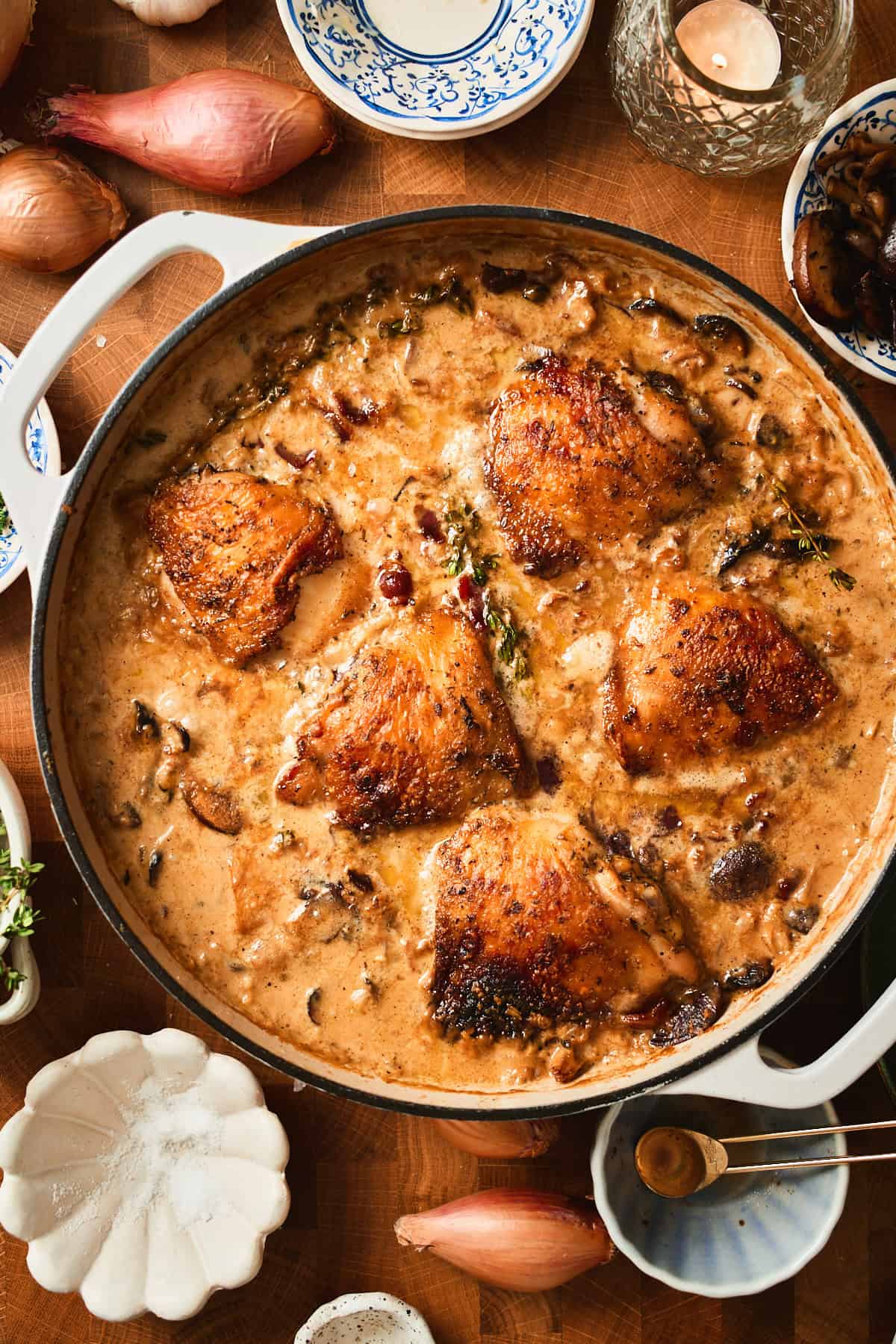 Baked chicken thighs in a creamy mushroom pan sauce with bacon.