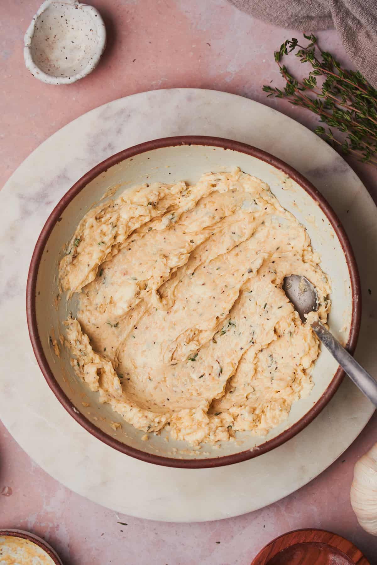 compound herb butter mixed together in a bowl.