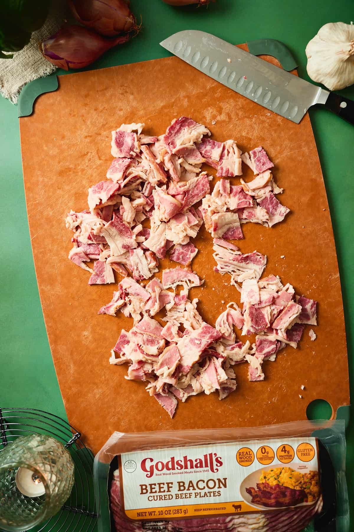 Godshall's beef bacon cut into pieces on a cutting board before rendering for tomato bacon pasta.