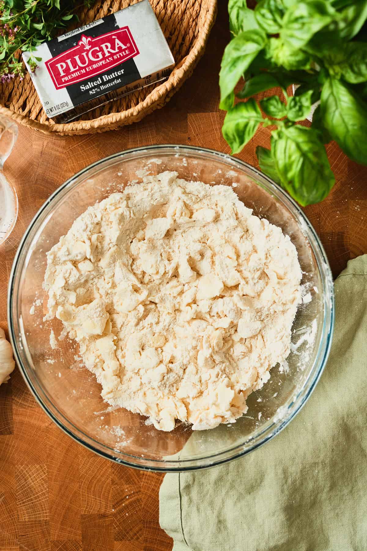 Flour and flattened butter worked into a shaggy mixture for an all-butter galette dough.