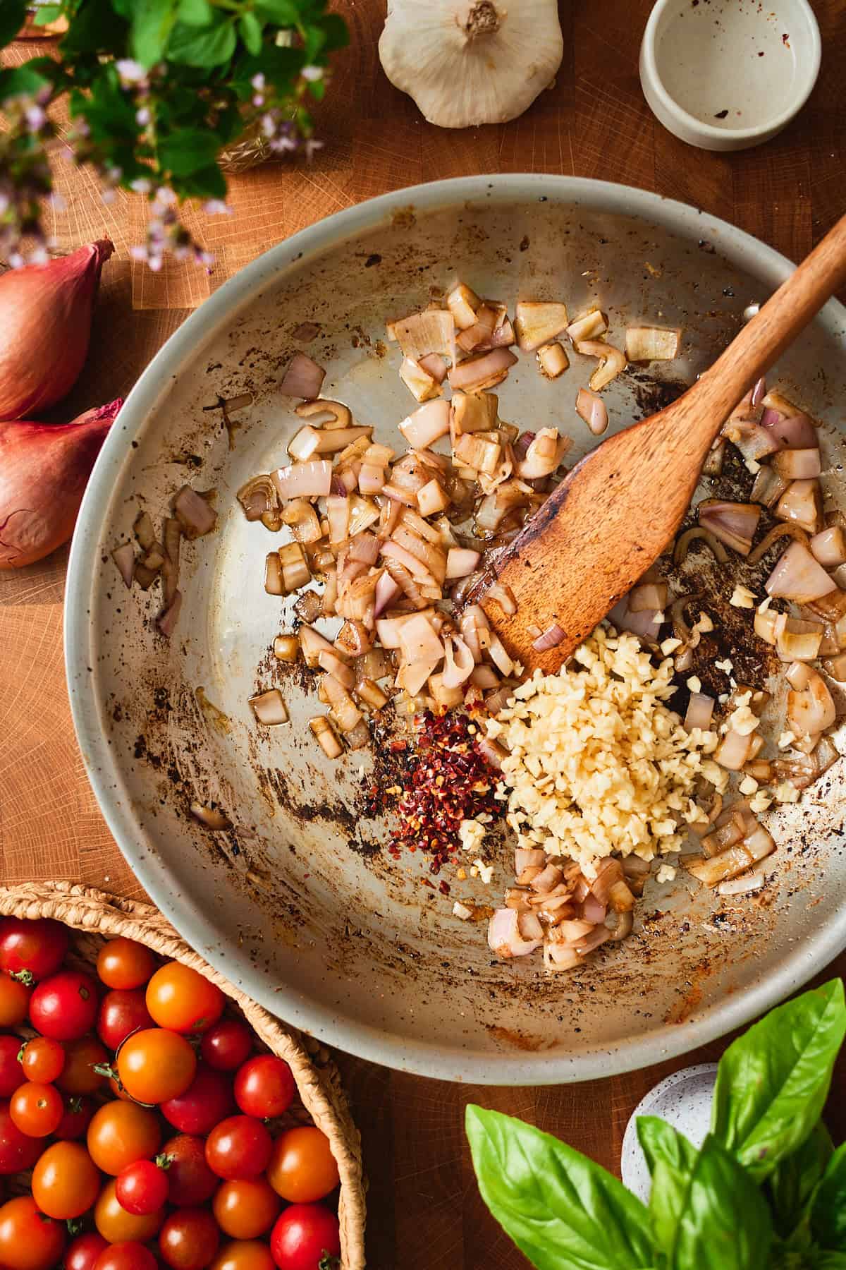 Softened shallot with minced garlic and red pepper flakes added to the skillet.