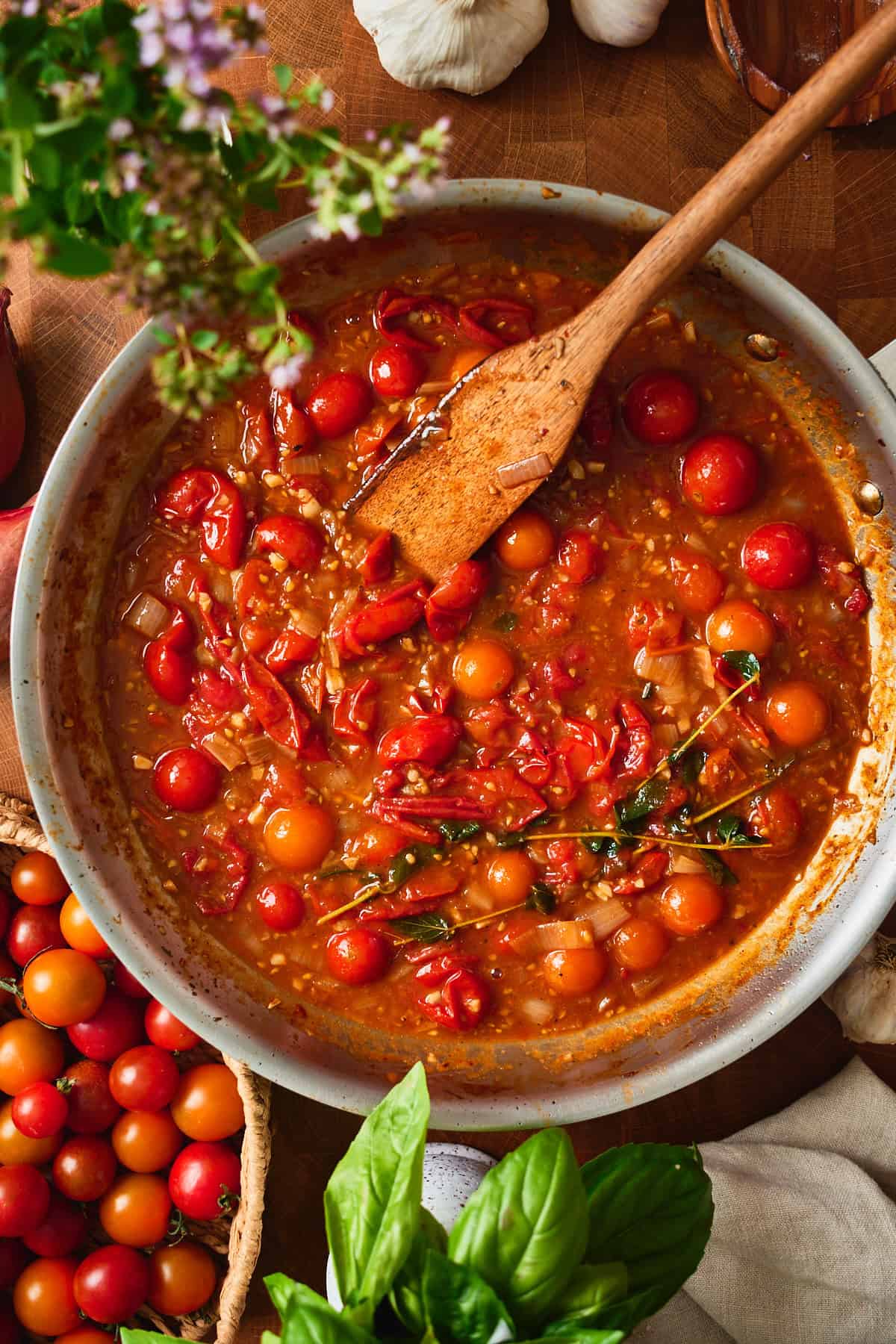 Reduced tomato pan sauce with whole Sungolds and split red cherry tomatoes.