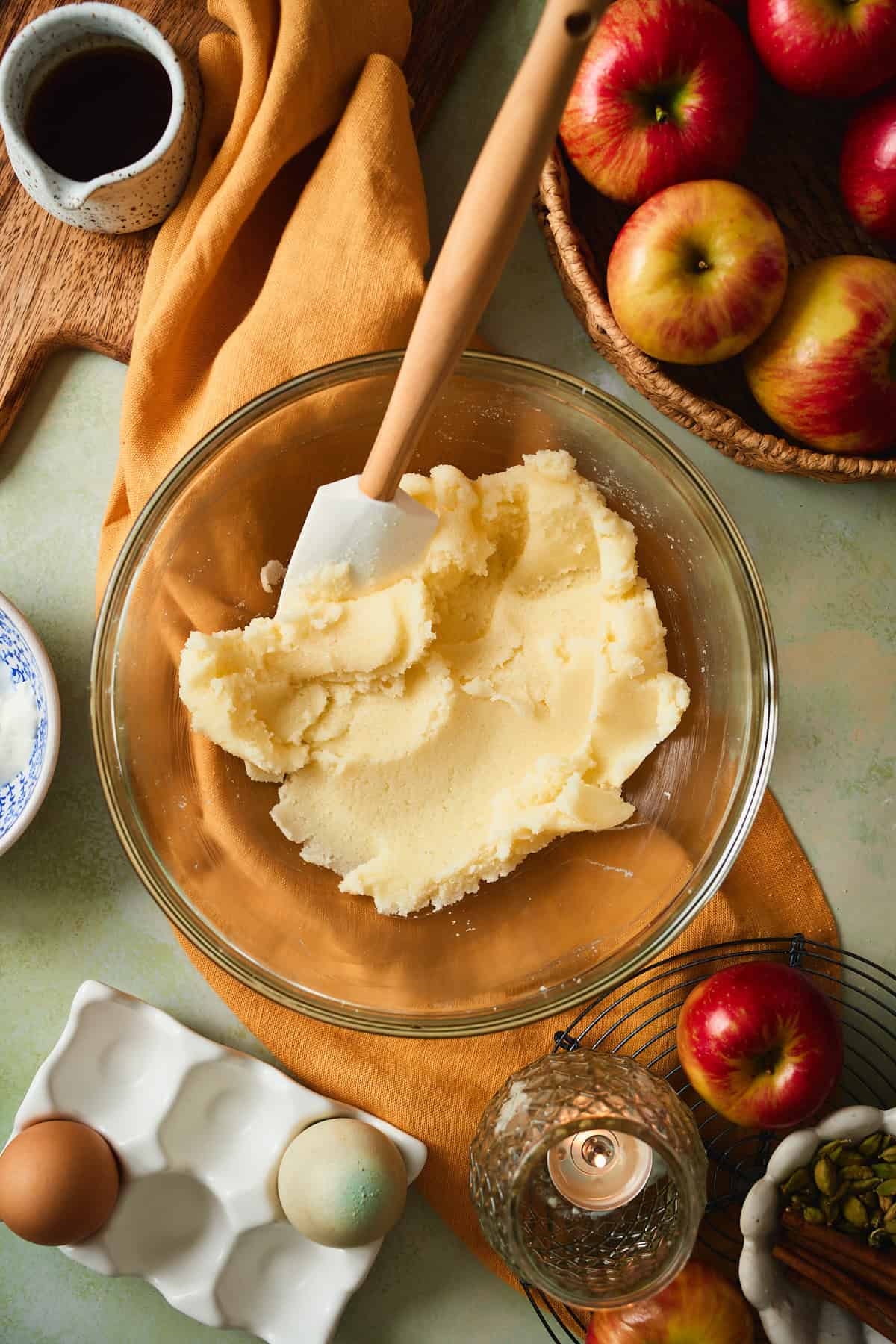 Butter and sugar creamed until pale and fluffy in a glass bowl.